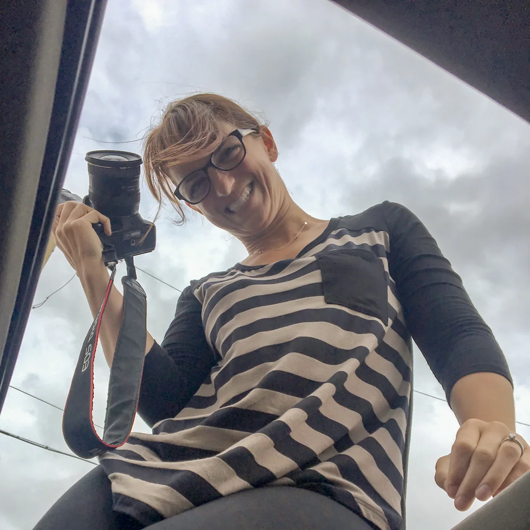 Katherine getting the shot through the moonroof of her car.