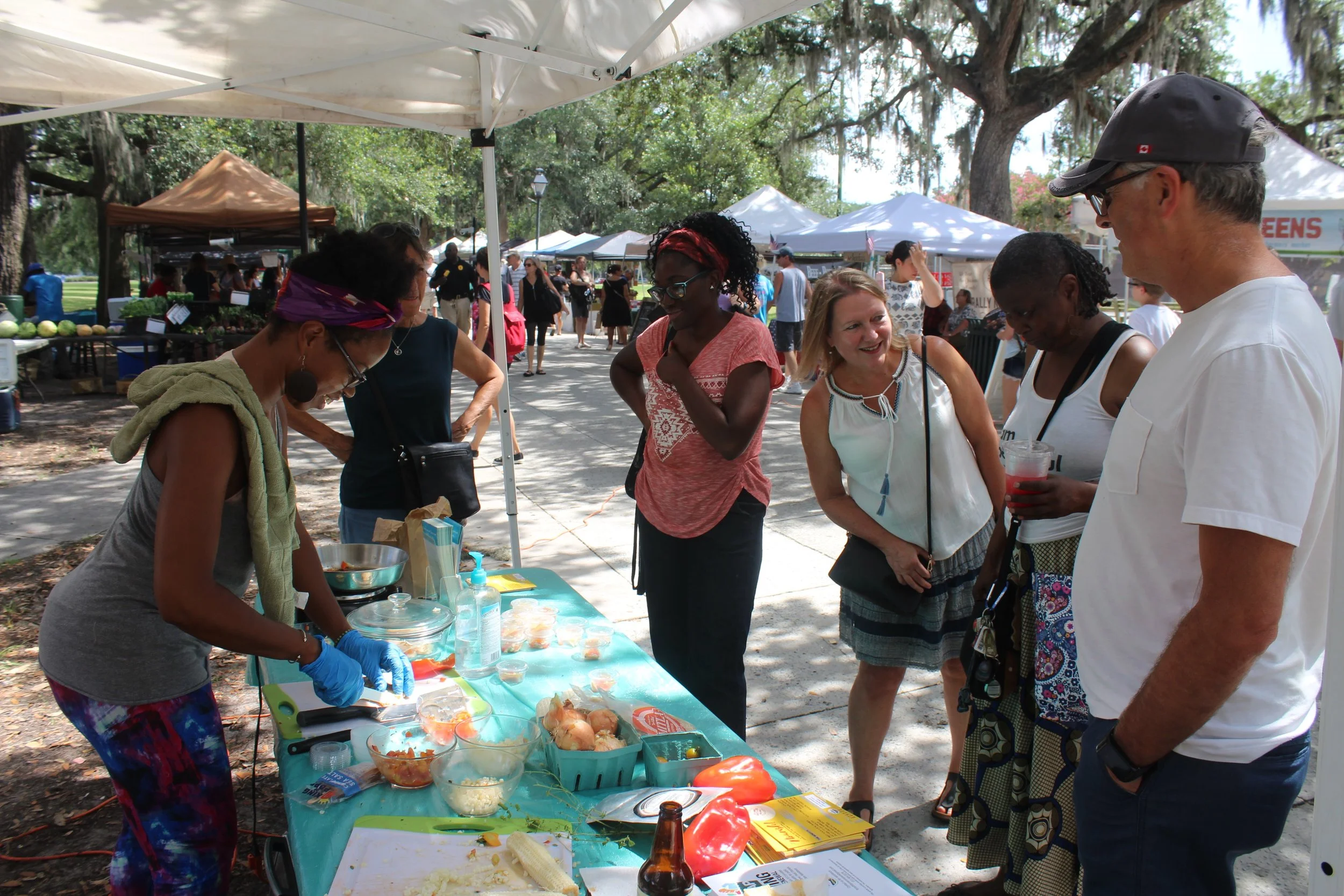Ayo Ngozi making tacos using all ingredients sourced from the Saturday market vendors. 