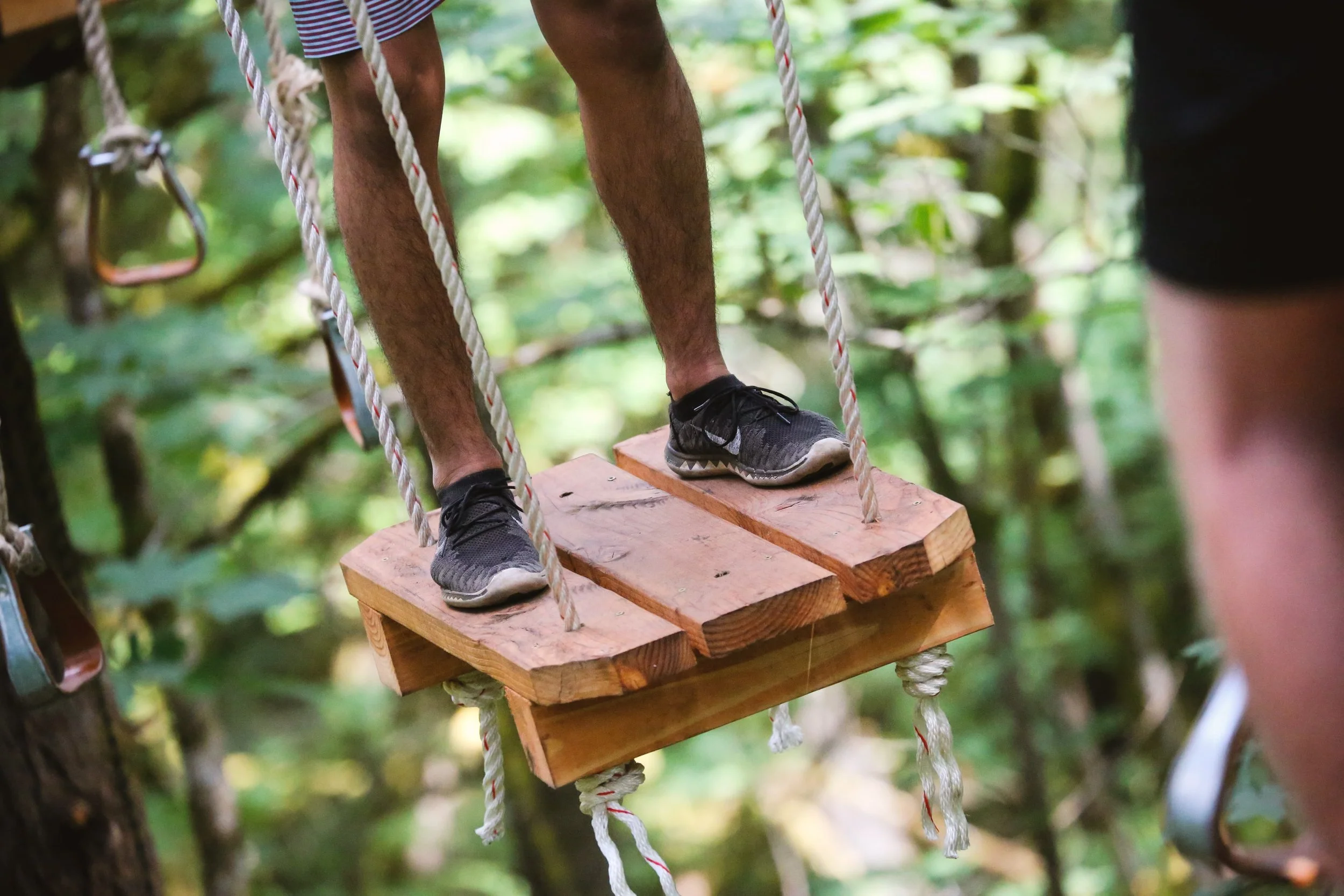 feet standing on aerial park element