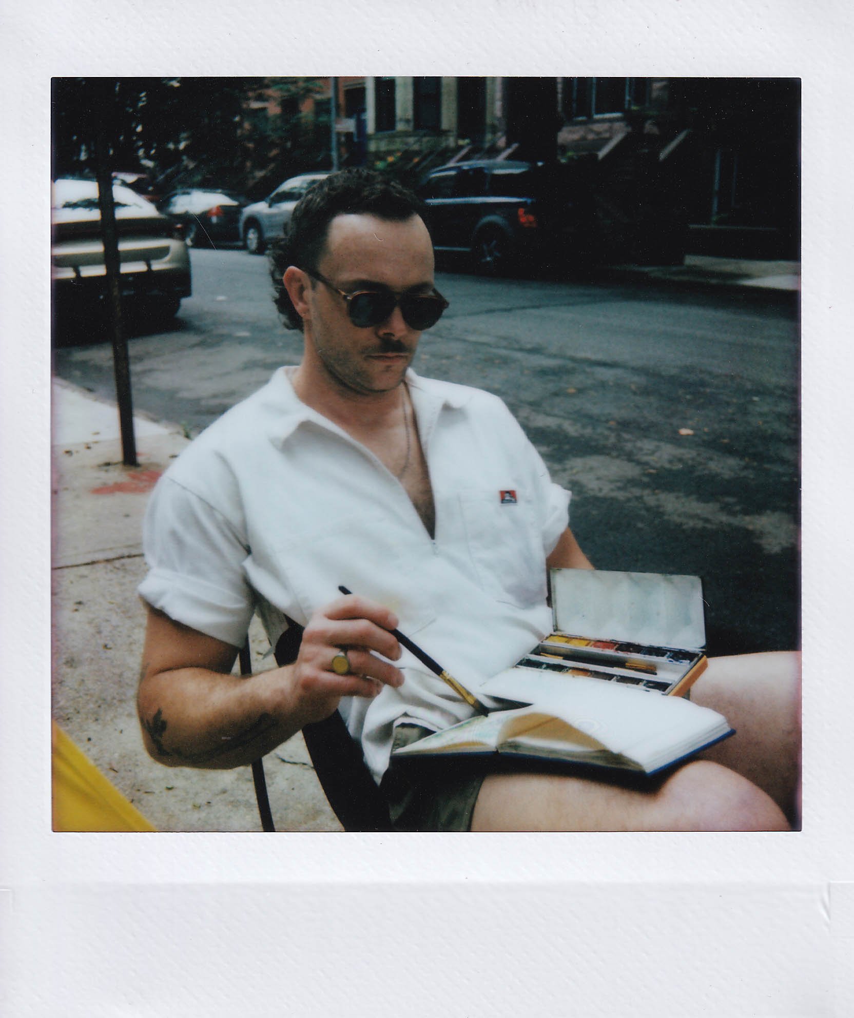 tucker doing a watercolor of flowers, bedford-stuyvesant, tuesday, 7-1-25.jpg