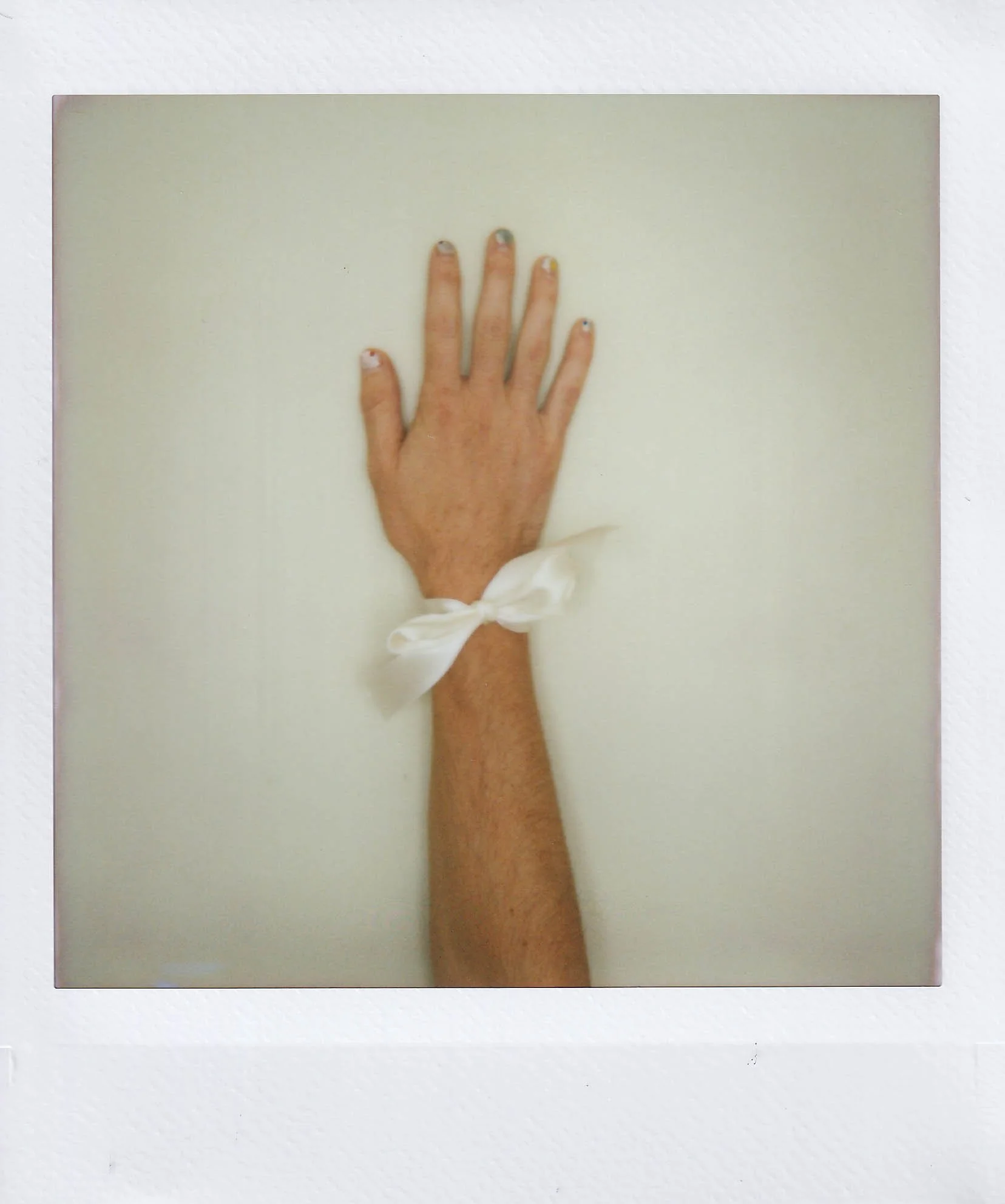 my hand 3, with a ribbon, that i bought from scraps, in my studio at my place, saturday, 8-23-25.jpg