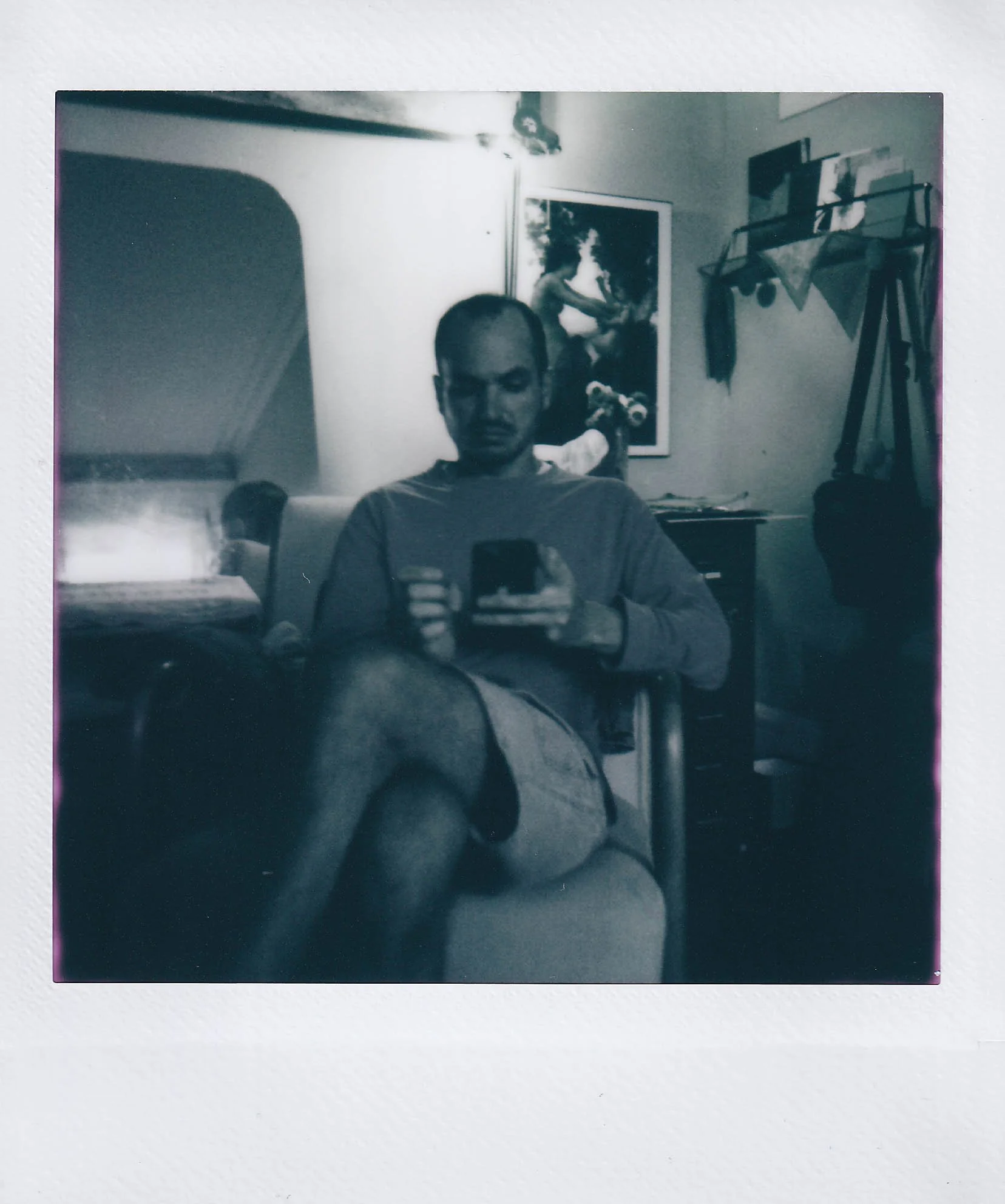 isaac on the phone, anna's room, anna is at class, packing to leave to go back to kc, monday, 9-8-25.jpg