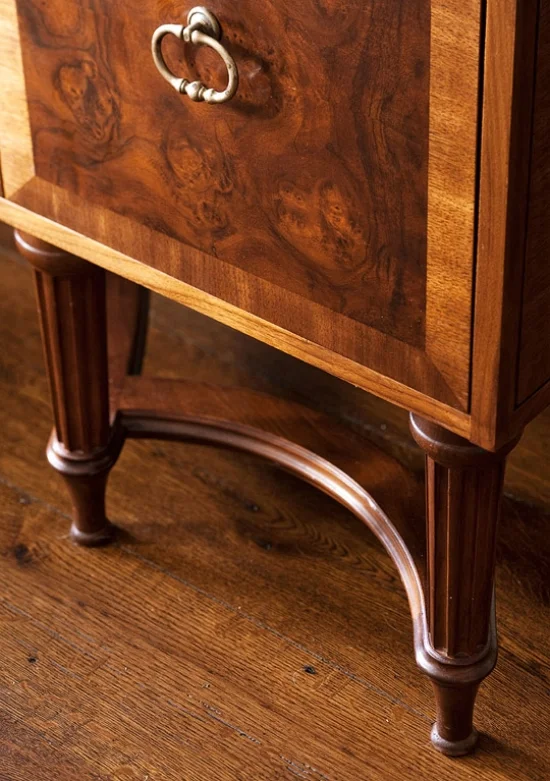 Burled walnut cabinetry with furniture-style legs set the tone in this formal kitchen by Austin Patterson Disston Architects. Discover other ways that pretty cabinet door styles can transform your next kitchen.