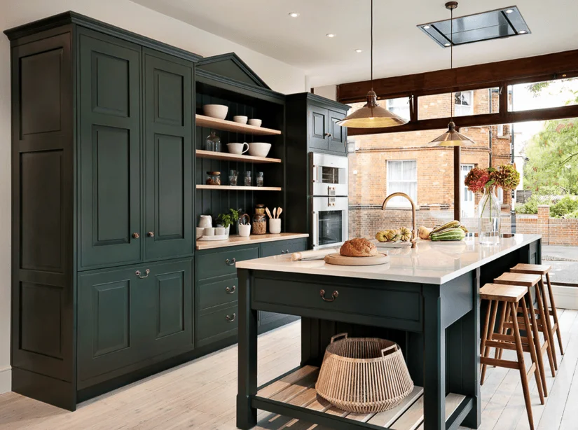 A transitional English kitchen design by Teddy Edwards, features a stream-lined pediment.