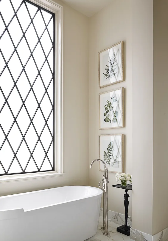If you don’t have the advantage of a private view from your master bathroom, consider using a leaded glass window. Architect Jeffrey Dungan brings his signature look to this bathroom by combining it with an almost modern freestanding bathtub. See other Master Bathtub Ideas. #luxurybathrooms, #traditionalbathroom