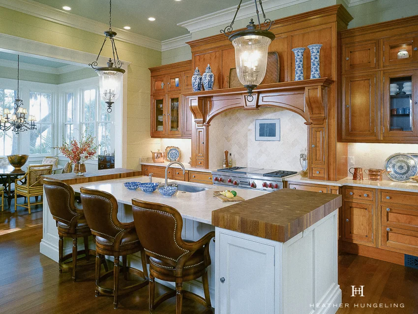 Lowcountry homes often have a quiet and soulful quality to them, so the interior design of the space should never feel overly done or contrived. A traditional wooden hood surround was chosen to compliment the historic nature of this kitchen, but was kept fairly simple so as not to compete with the stunning view. #luxurykitchendesigns, #clivechristian, #traditionalkitchens