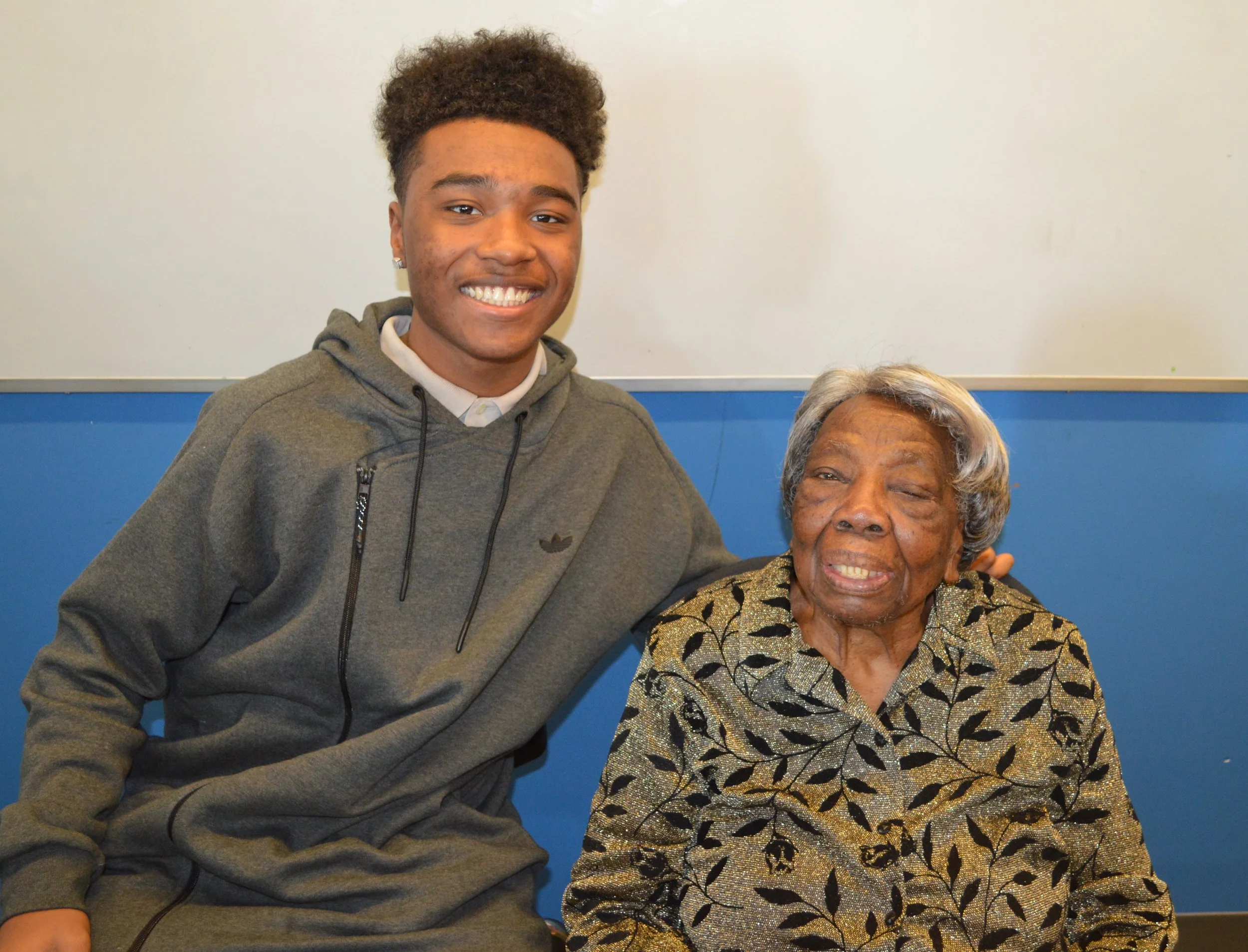 A student with Ms. Virginia McLaurin.