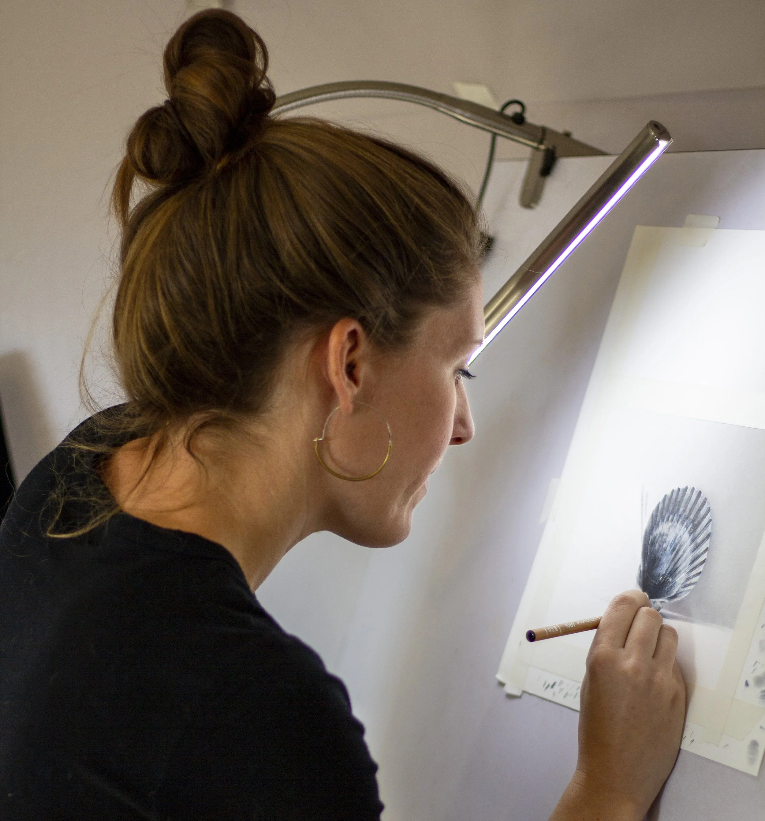 Megan Seiter working on a colored pencil drawing
