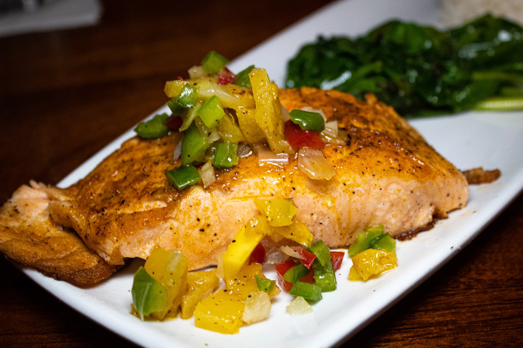 SPICE DUSTED SALMON - Coconut Scallions Basmati Rice, Sautéed Spinach & Mango Pineapple Salsa