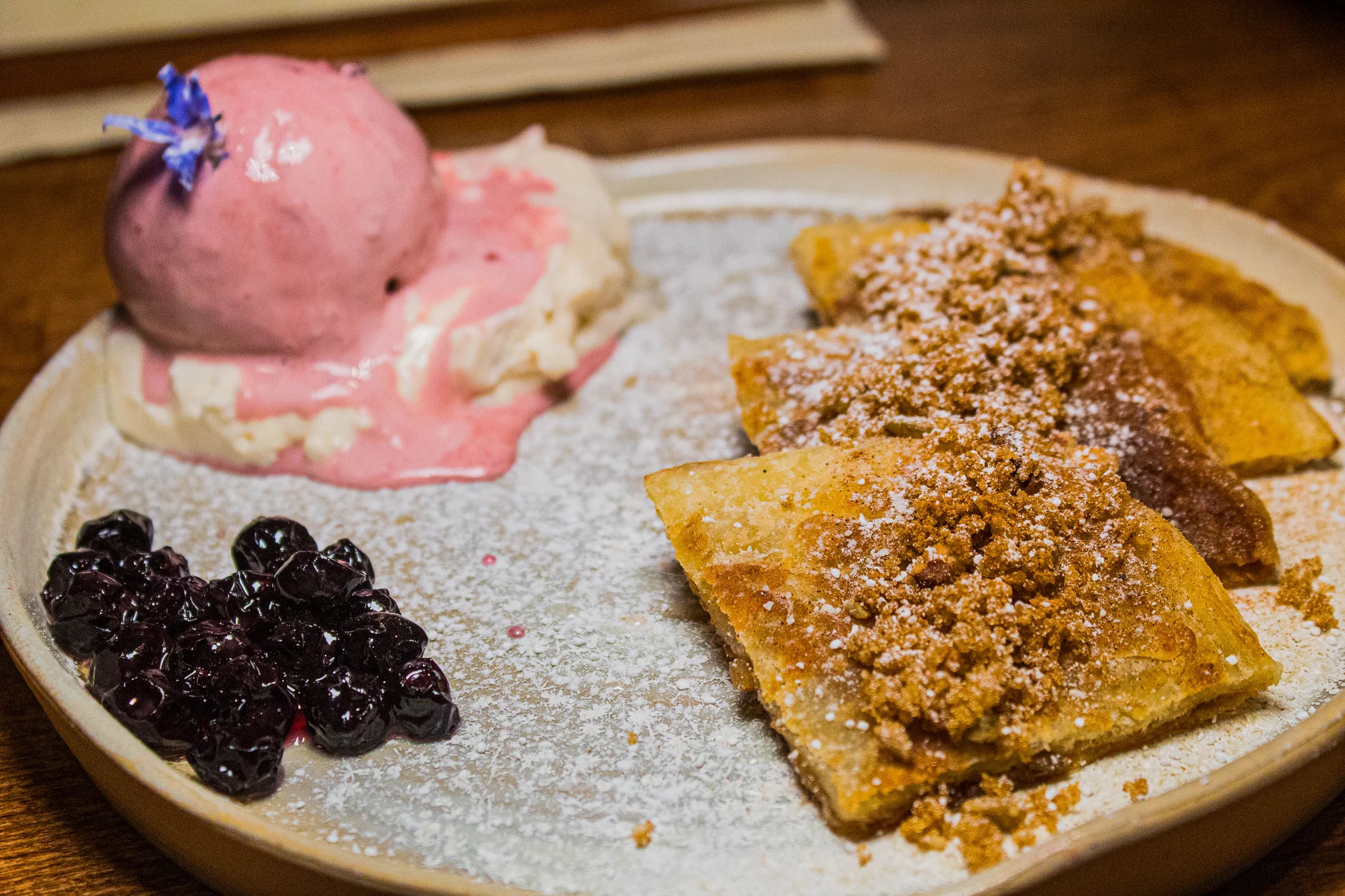 Hotteok - Korean sweet pancake, pecan, walnut, sunflower seed, red bean ice cream, blueberry whipped cream, and blueberry compote