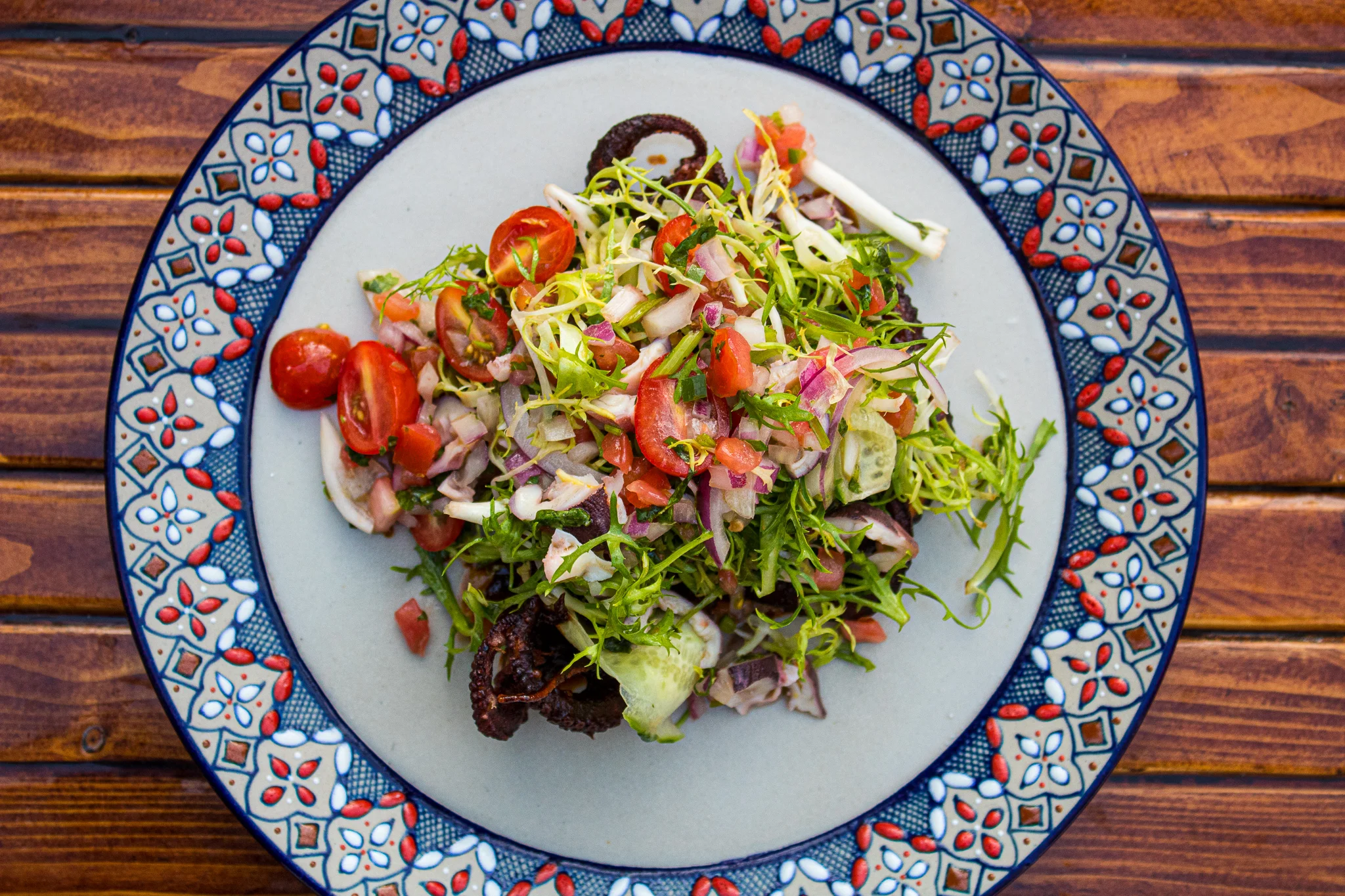 Crispy Octopus - Tamarind Pasilla Glaze, frisse, Grape tomatoes and cucumber pico de gallo