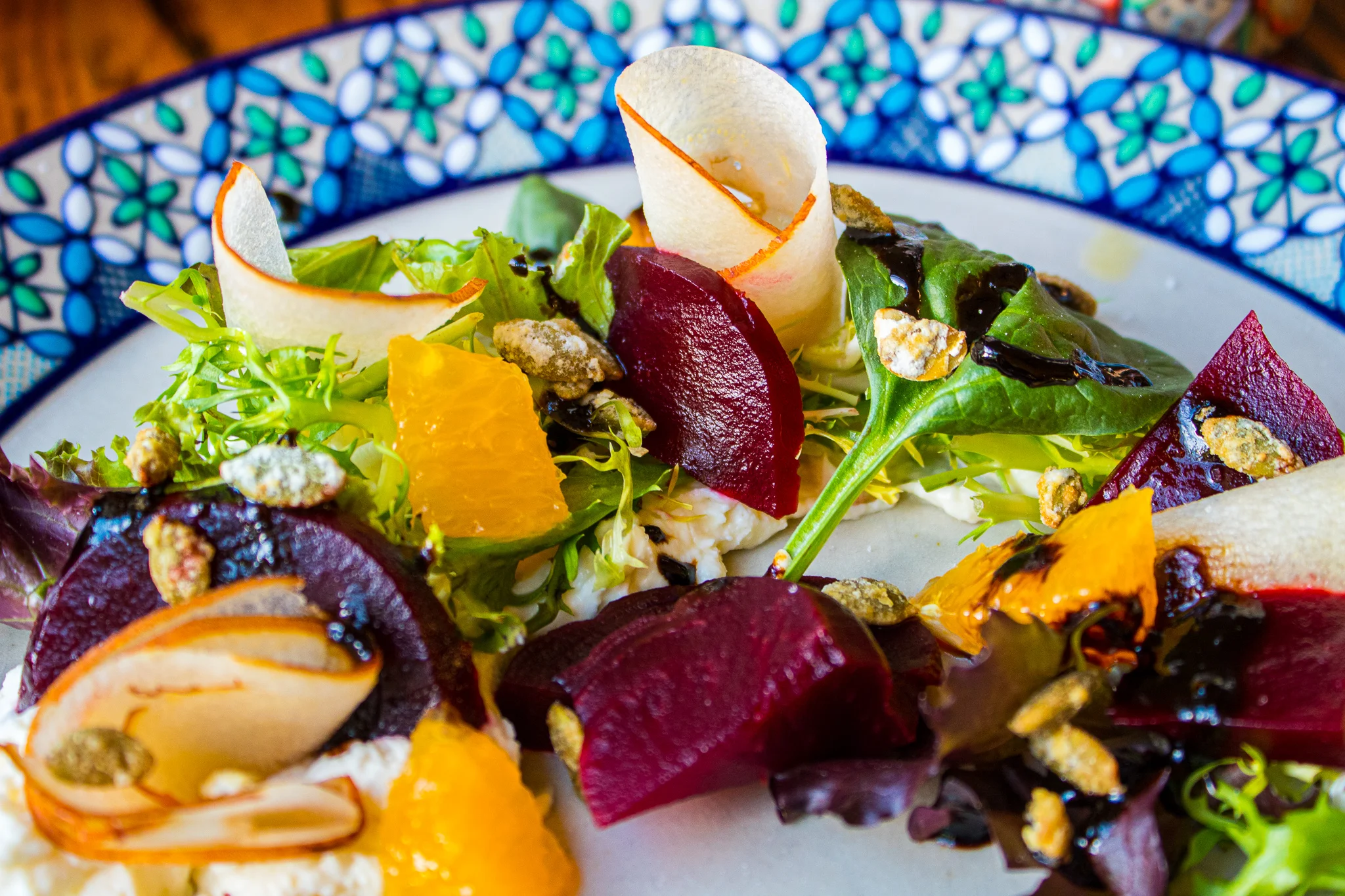 Roasted Beet Salad - Apple, Candied Pumpkin Seeds, Orange, Baby greens. Requeson & Tamarind-Balsamic Glaze