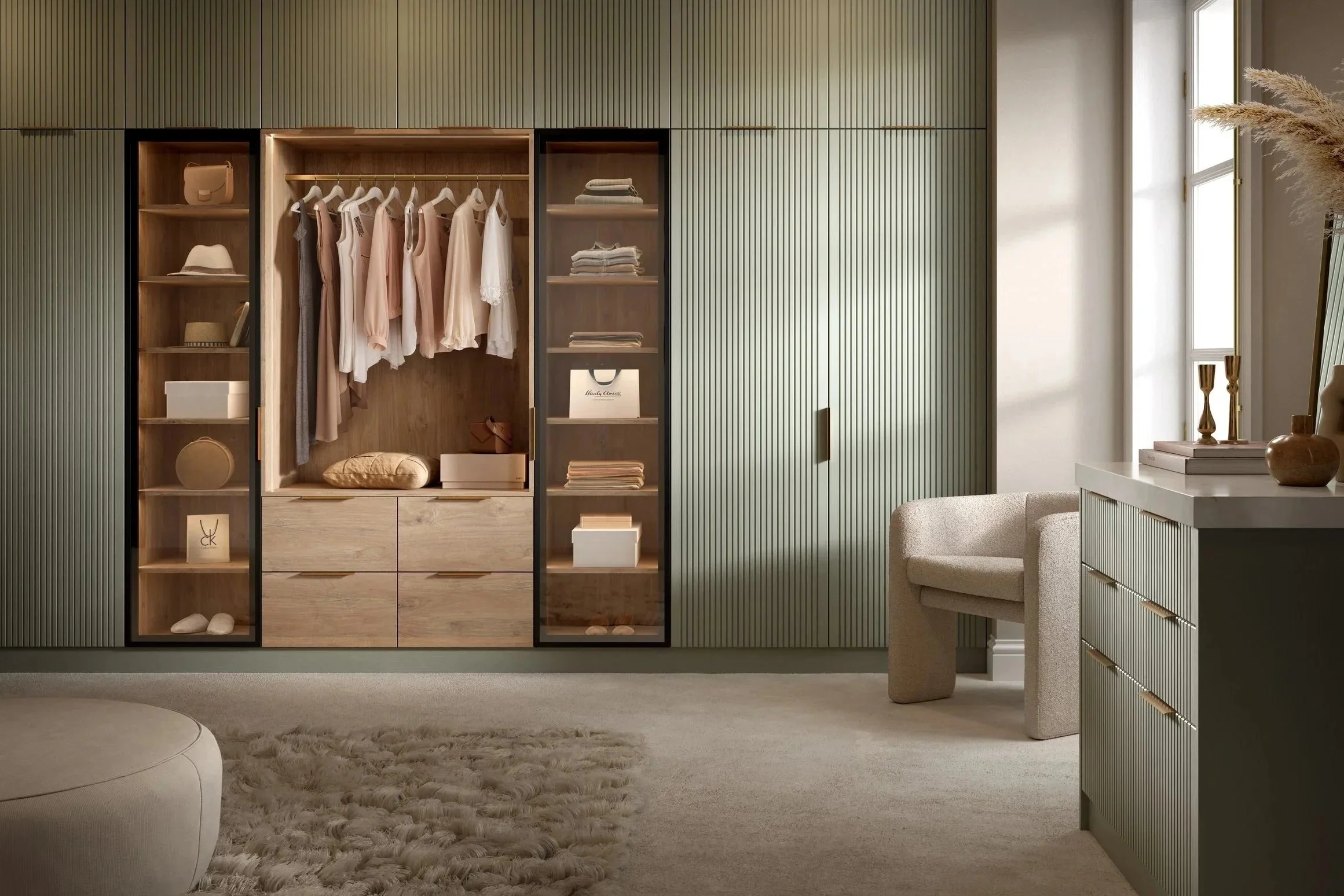 Modern fitted wardrobes in Sussex with glass doors and bespoke built-in storage