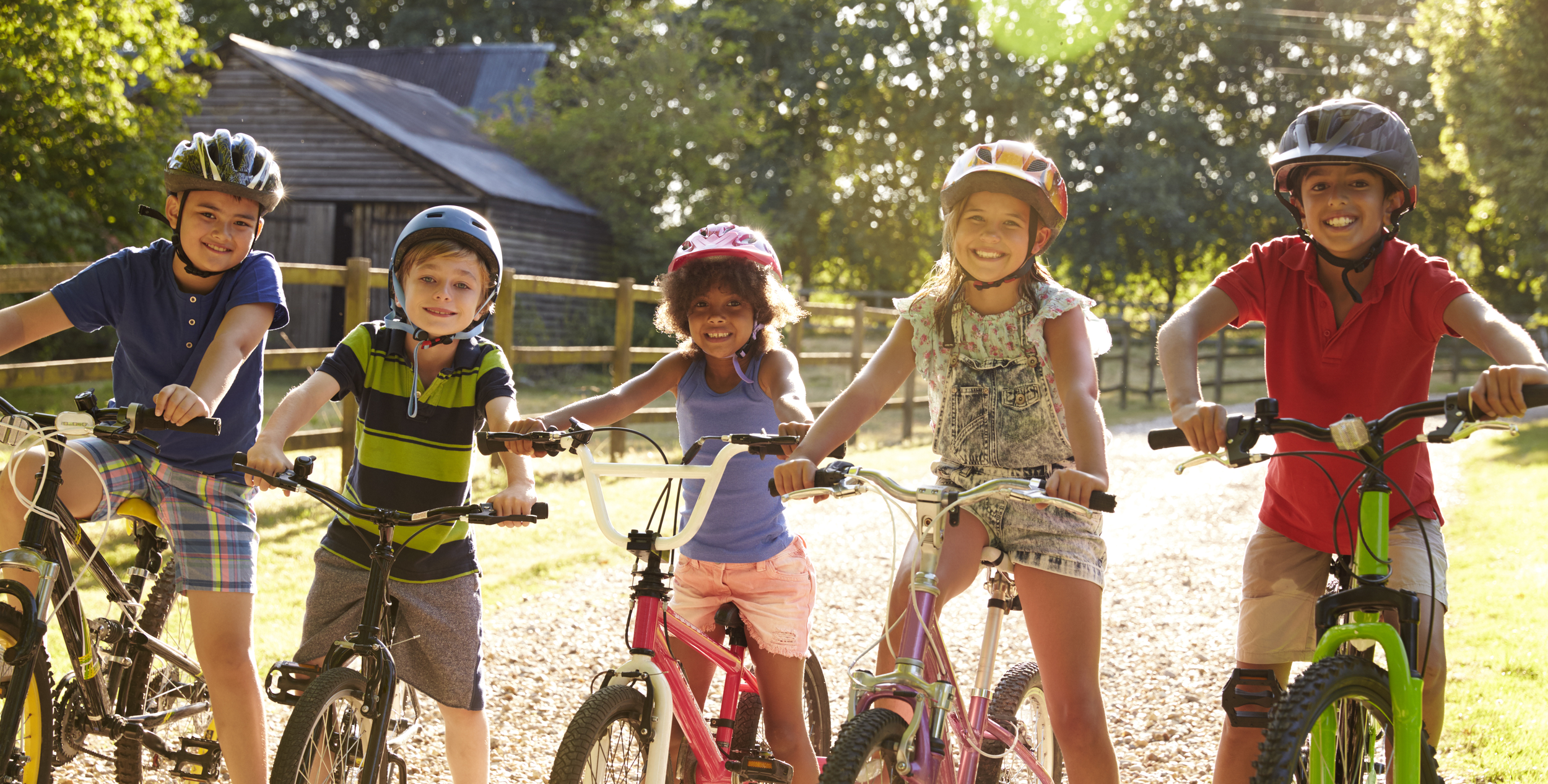 Two girls sitting on bicycles