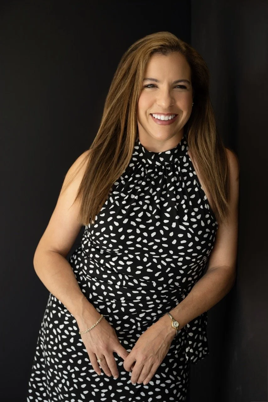 woman smiling-polka dot dress-headshot