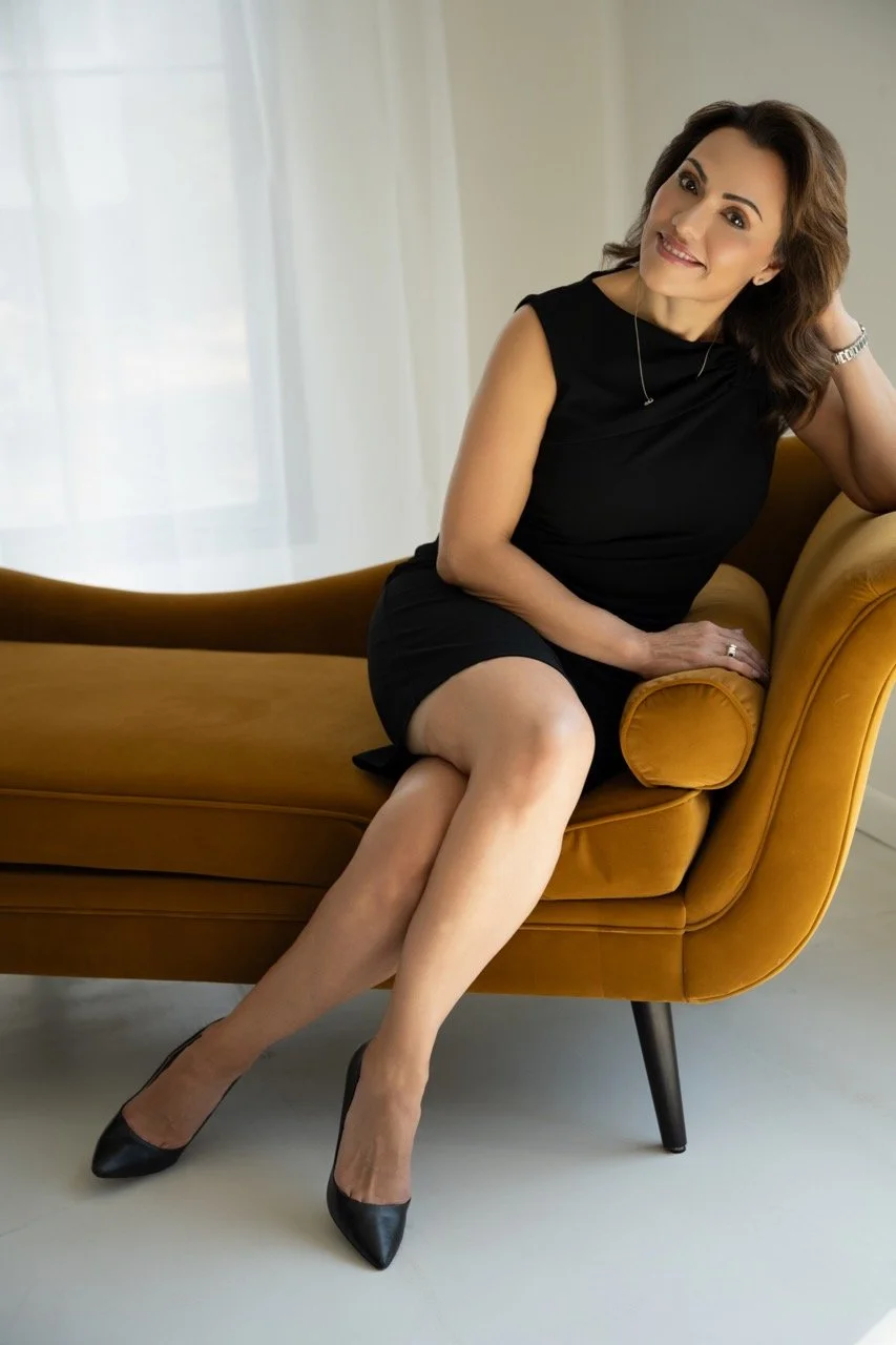 black dress-sitting on couch-headshot