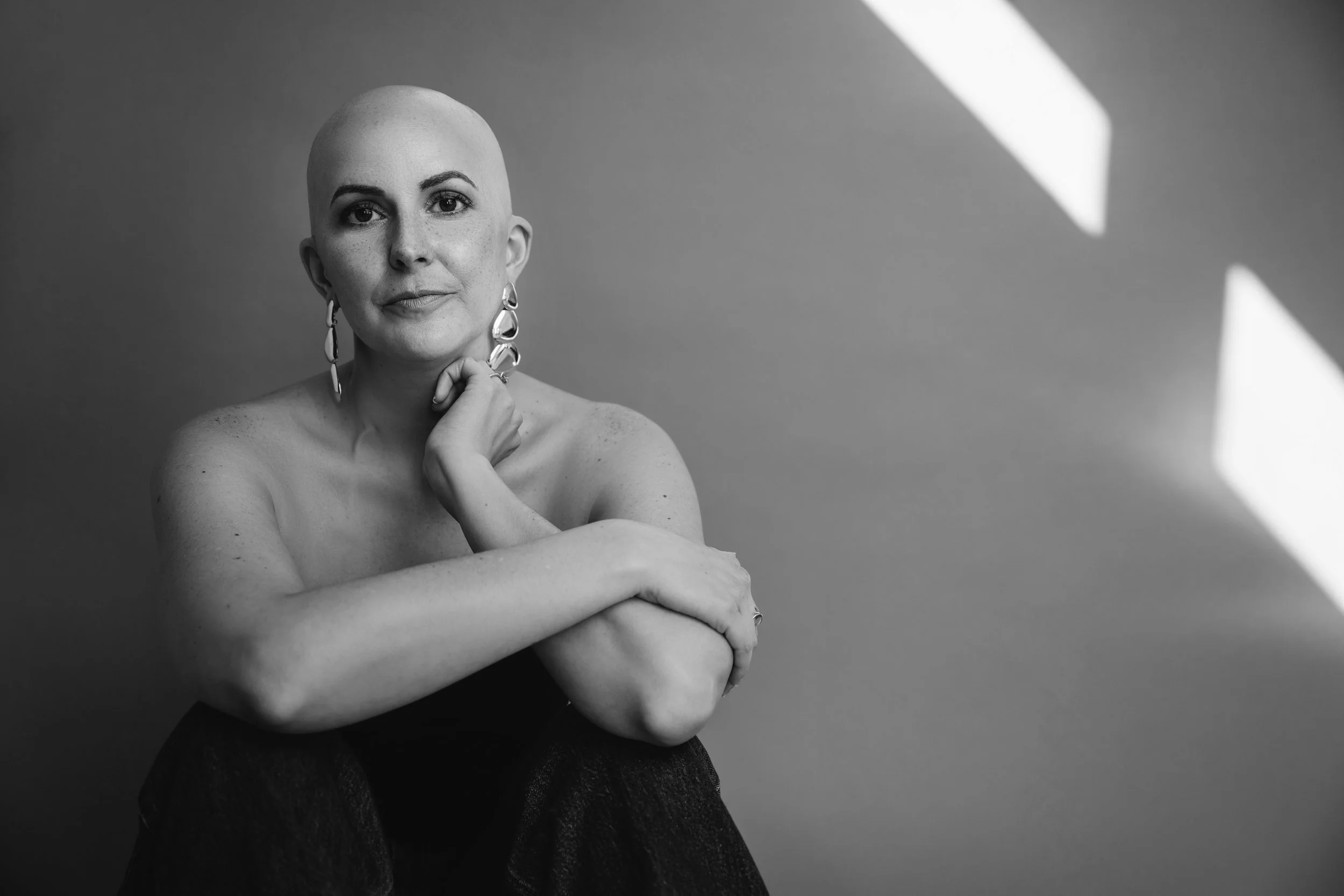 Black and white portrait in Austin capturing strength, vulnerability, and timeless beauty through fine art photography.