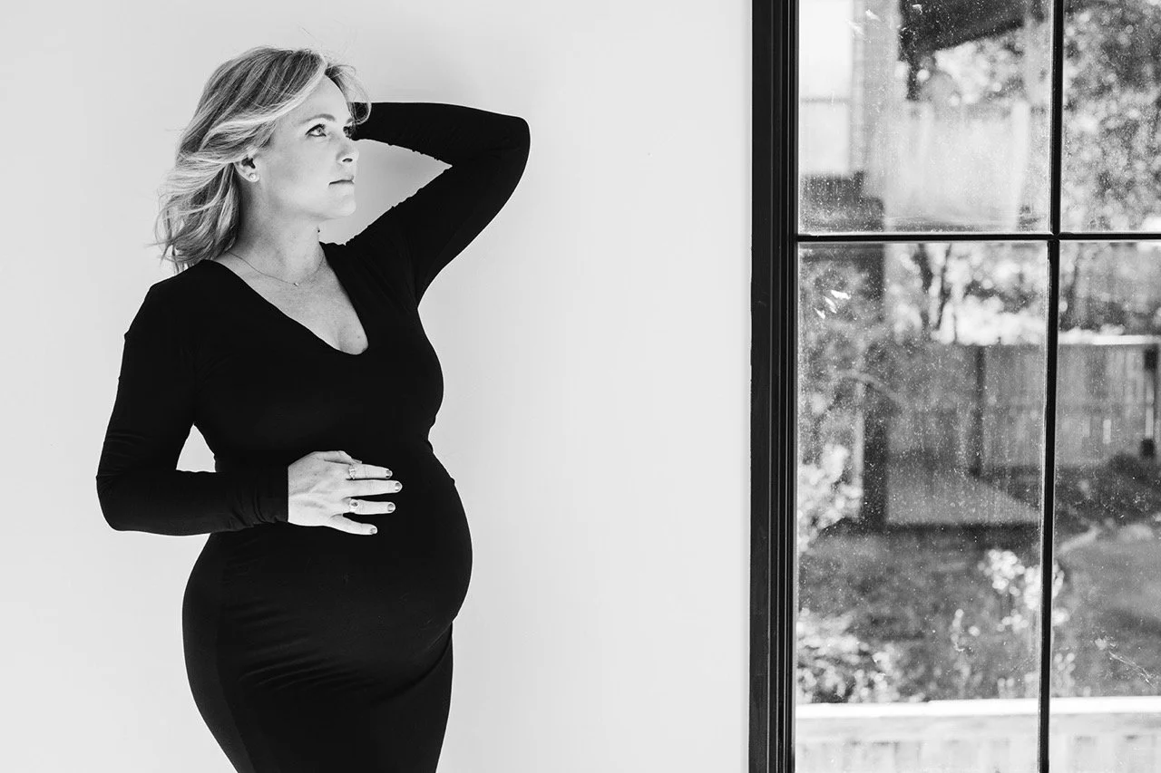 black and white maternity portraits Austin elegant and chic black dress maternity photoshoot