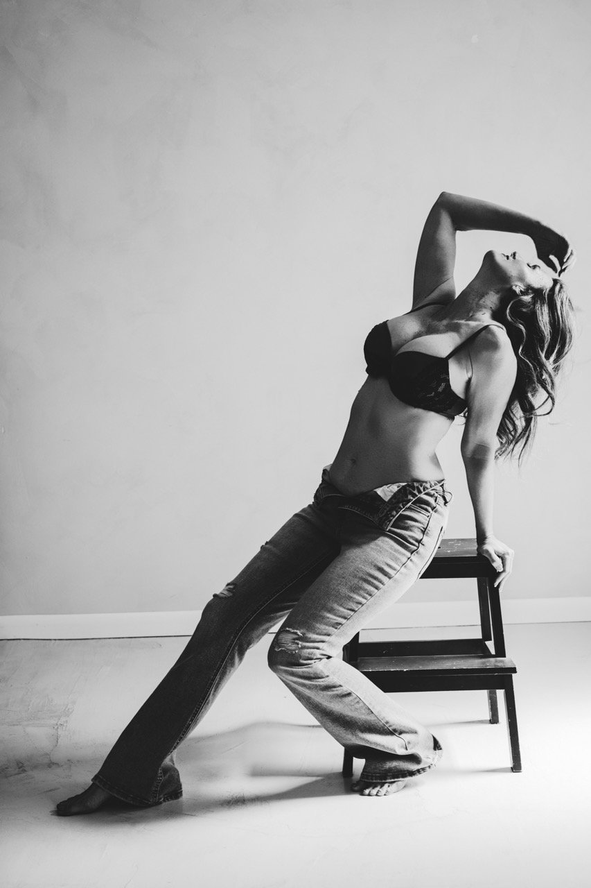 Boudoir woman in lingerie and denim, monochrome