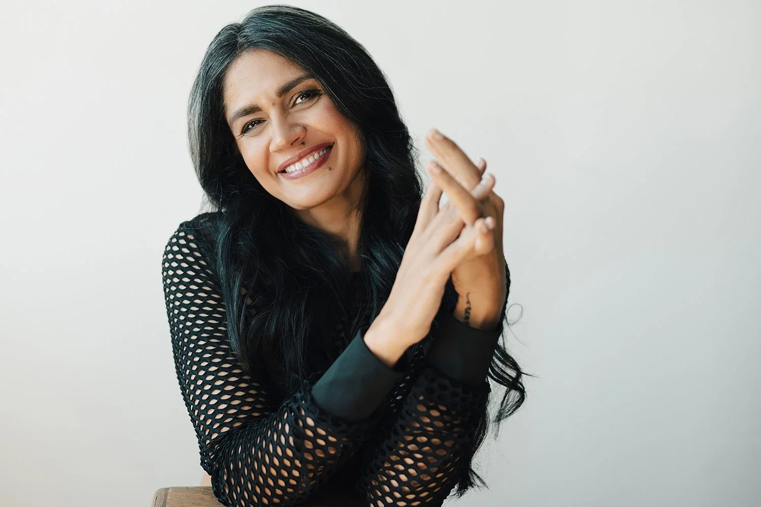 A portrait that feels like an exhale. Soft light, open posture, and an easy smile that speaks to confidence earned not performed. This is the kind of presence that invites trust before a word is spoken.