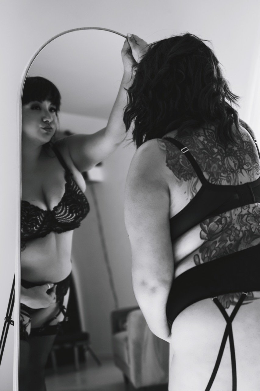 Boudoir woman in lingerie, monochrome, mirror pose