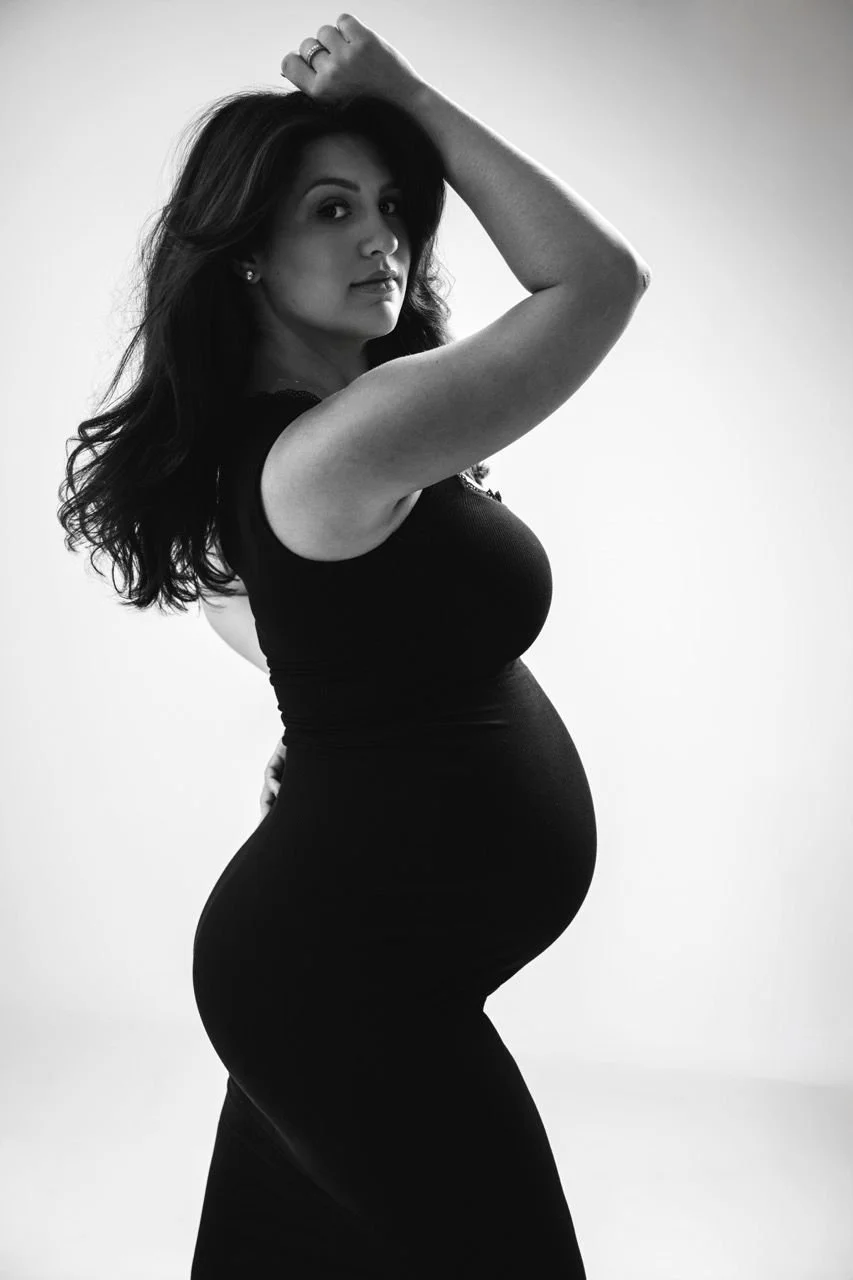 A sculptural black and white maternity portrait of a pregnant woman in profile, highlighting the strength, elegance, and timeless beauty of motherhood. Valentina Portraiture in Lakeway, TX
