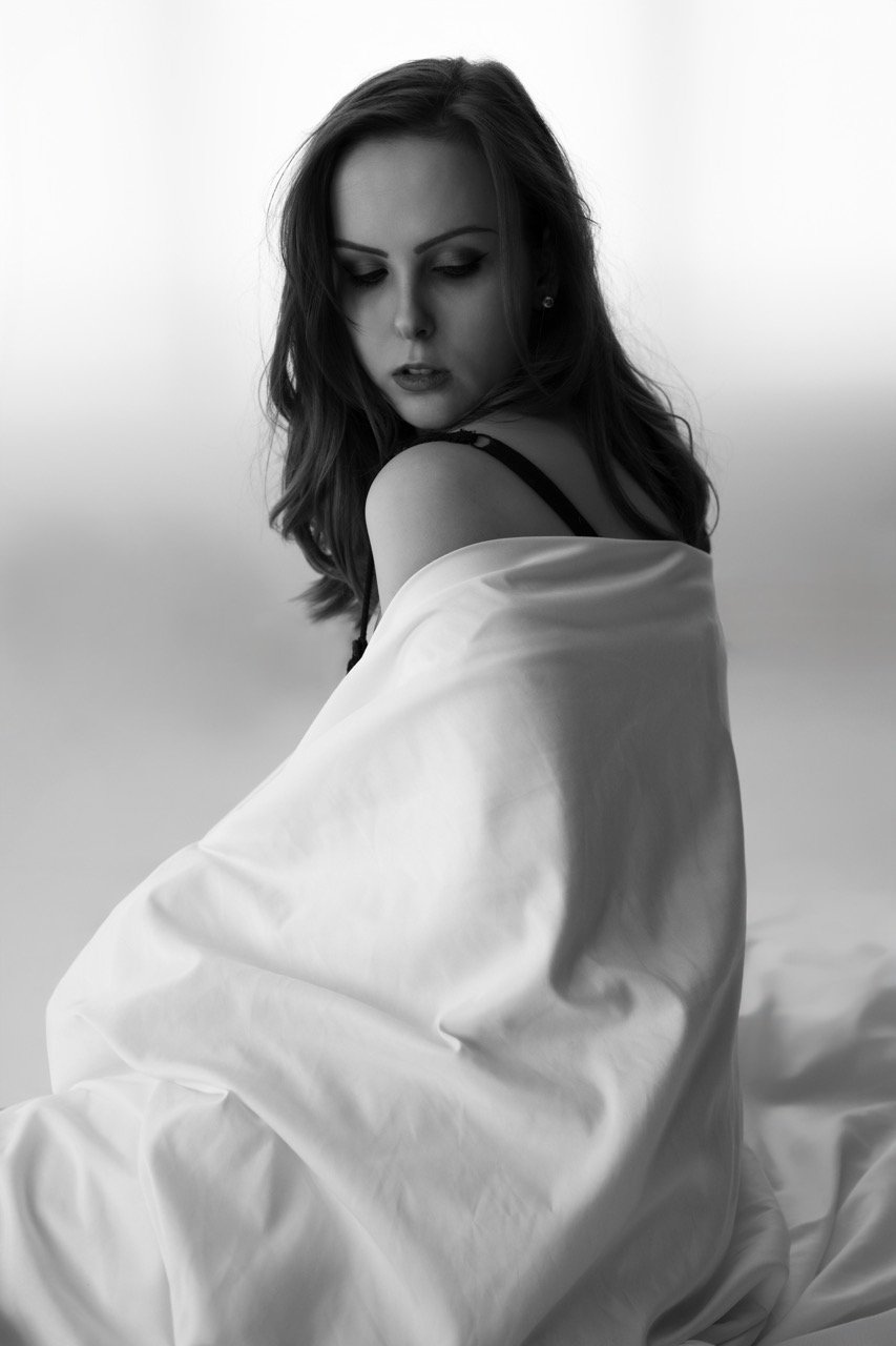 Woman white sheet self-portrait