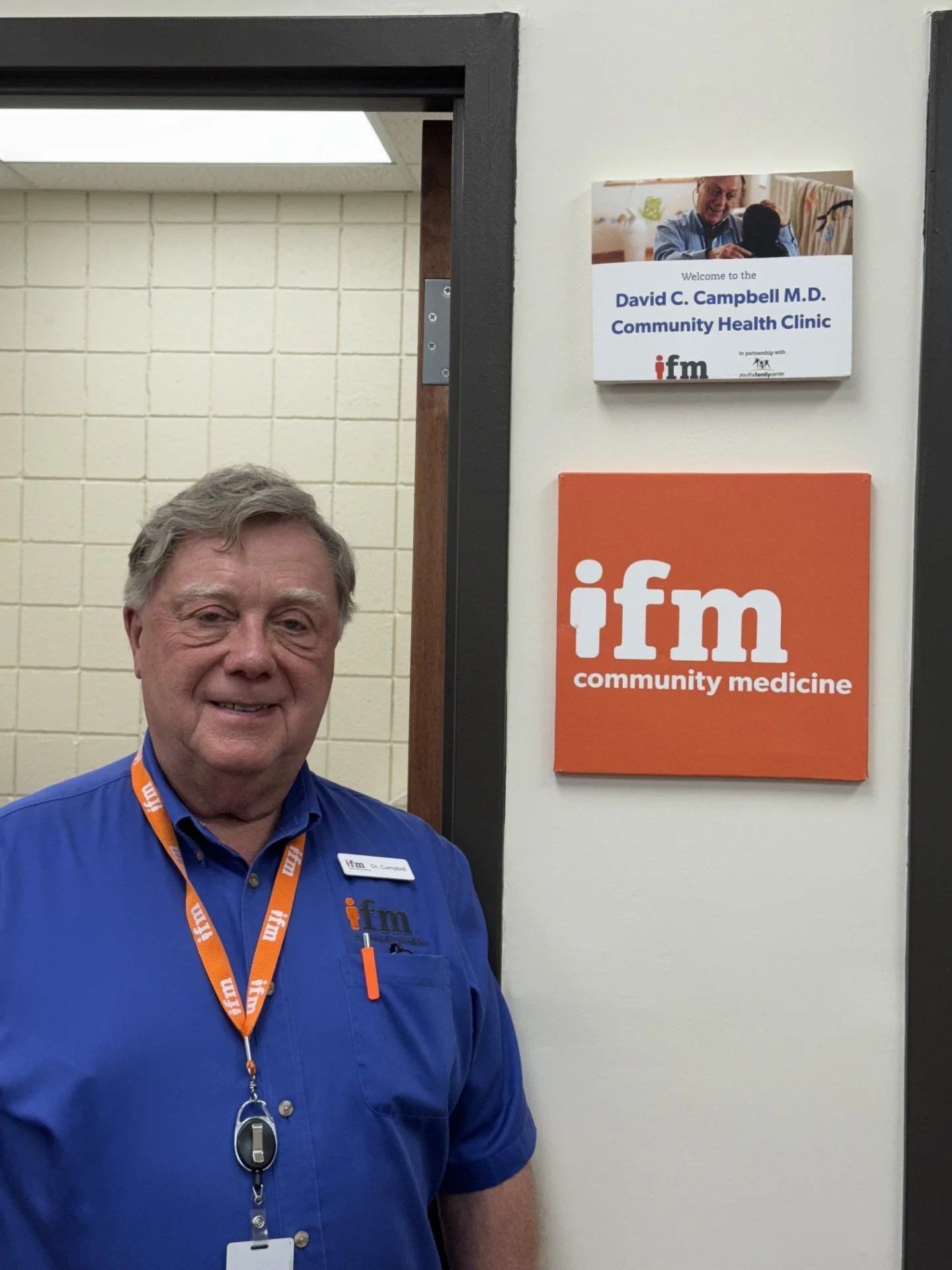 Dr. C with YFC sign.jpg