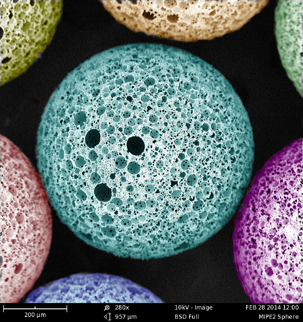 SEM of a porous microsphere made of propylene fumarate dimethacrylate. Artificial coloring done with Photoshop. Materials Research Society Science as Art 2016 award. 