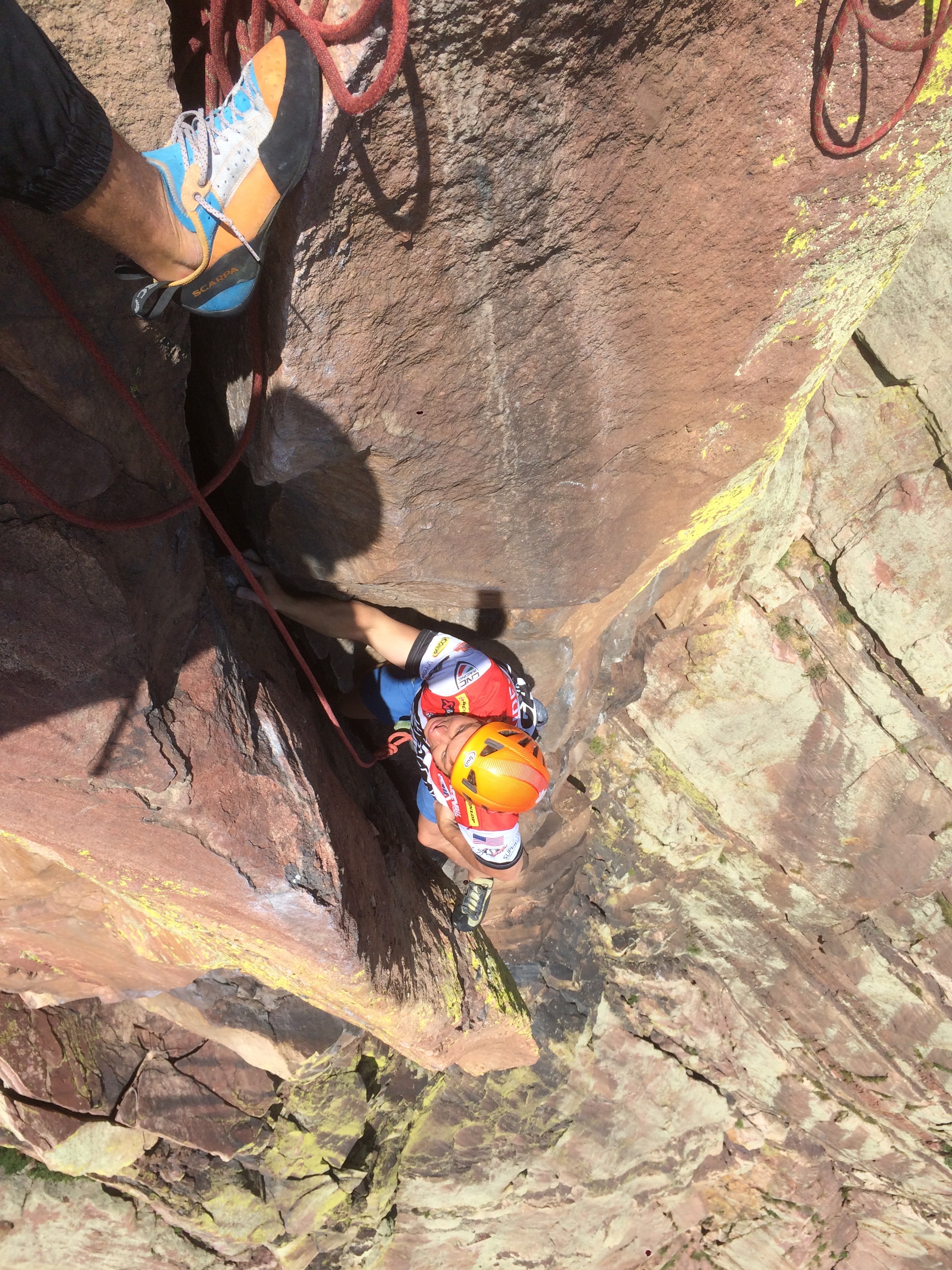  Looking down the last 5.11 pitch from the super exposed belay before a mellow romp to the top.&nbsp; 