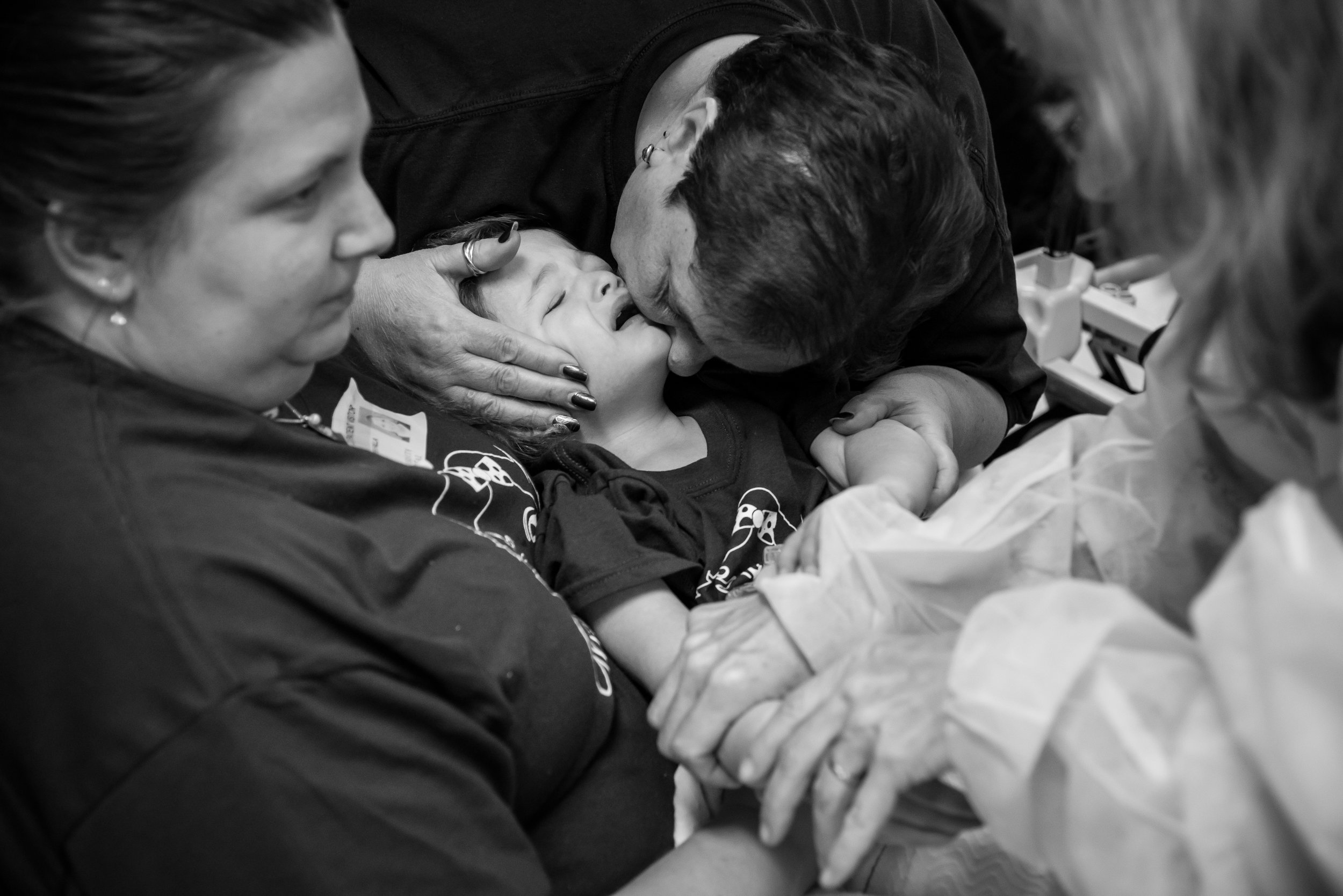 A doctor removes Arianna's IV as she cries in her mother's arms and her grandmother attempts to comfort her. Arianna's parents worry about her doctors not being aggressive enough, and have considered alternative treatment options.