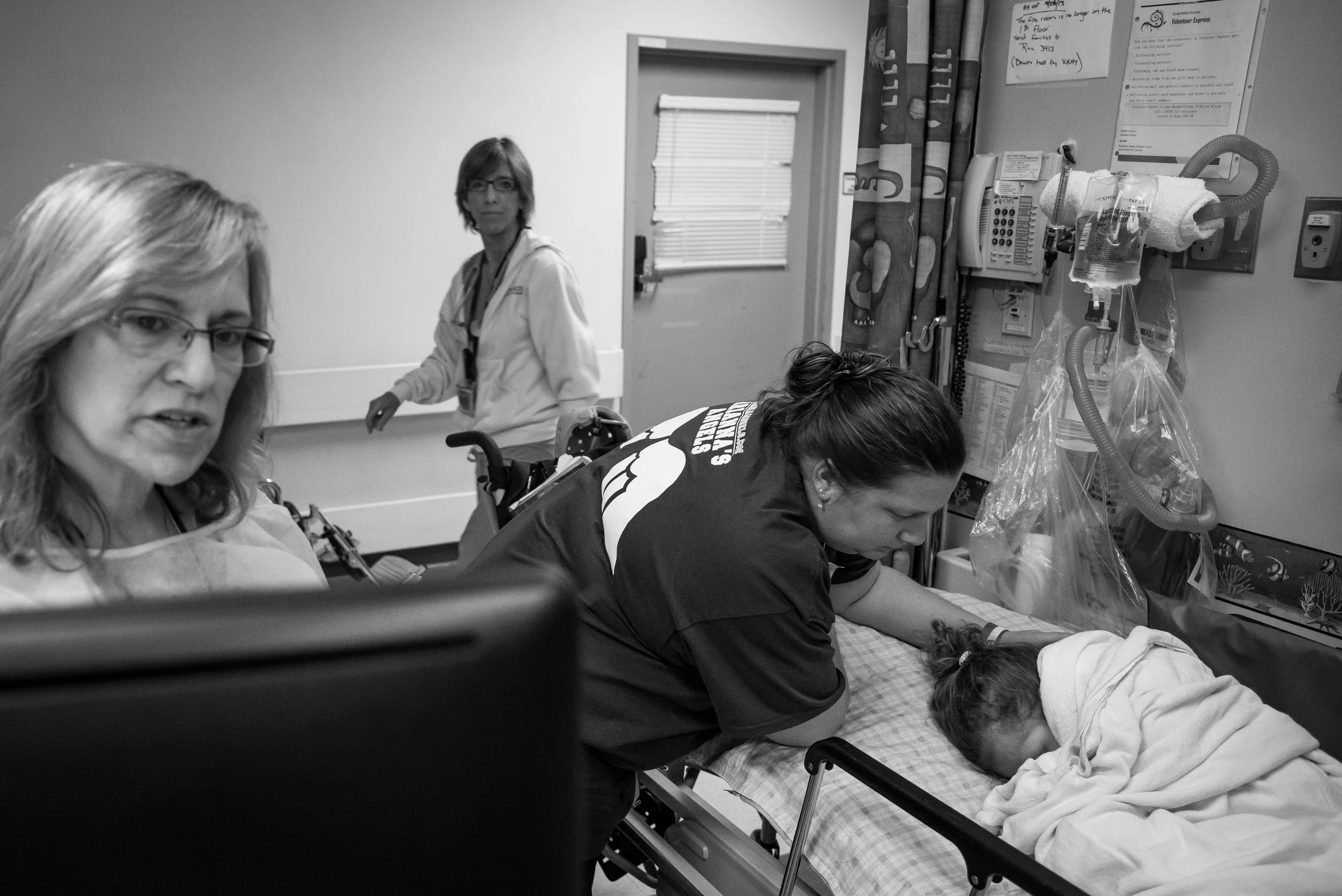 Jennifer Failla, Arianna's mother, comforts her as she wakes up from an anesthetic. Arianna was given an MRI to prepare for brain surgery, which was scheduled for a few weeks later.