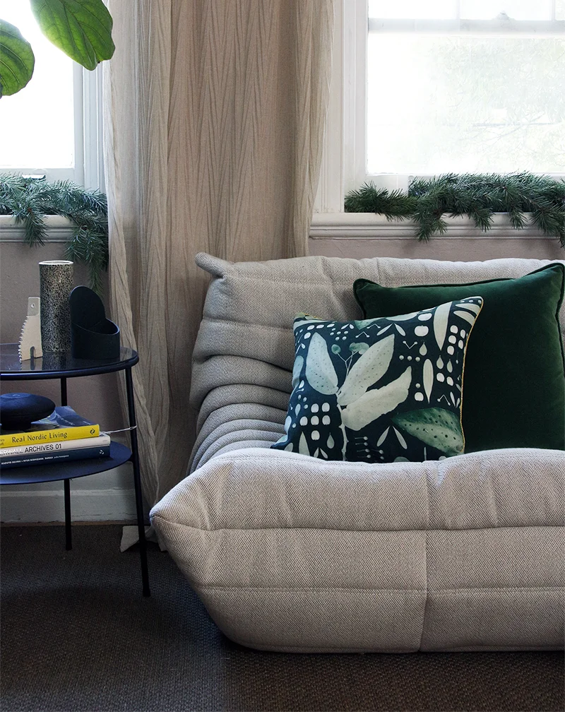 Decorate the window sills with fresh pine branches and slip on a few green cushion covers. These gorgeous patterned botanical linen cushion covers by Peaches & Keen have a metallic gold piping which makes them the perfect festive addition at Christmas and all year round.