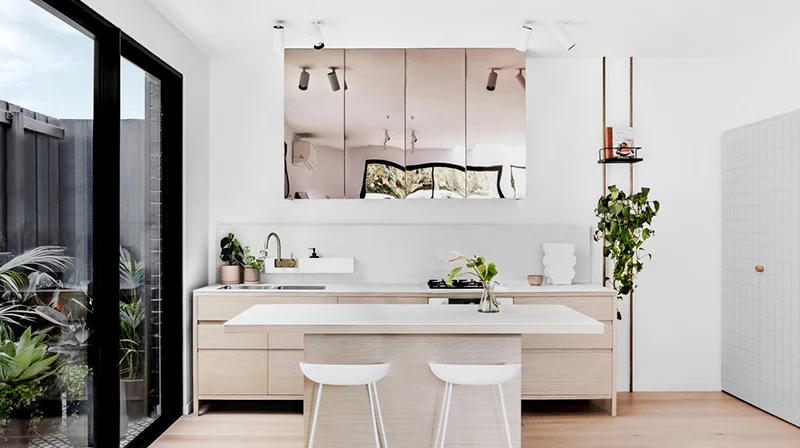 Instead of wall to wall storage, some breathing space can greatly enhance the overall feel of the apartment as seen in this interior by The Stella Collective. Interiors – The Stella Collective . Photo – Maegan Brown .