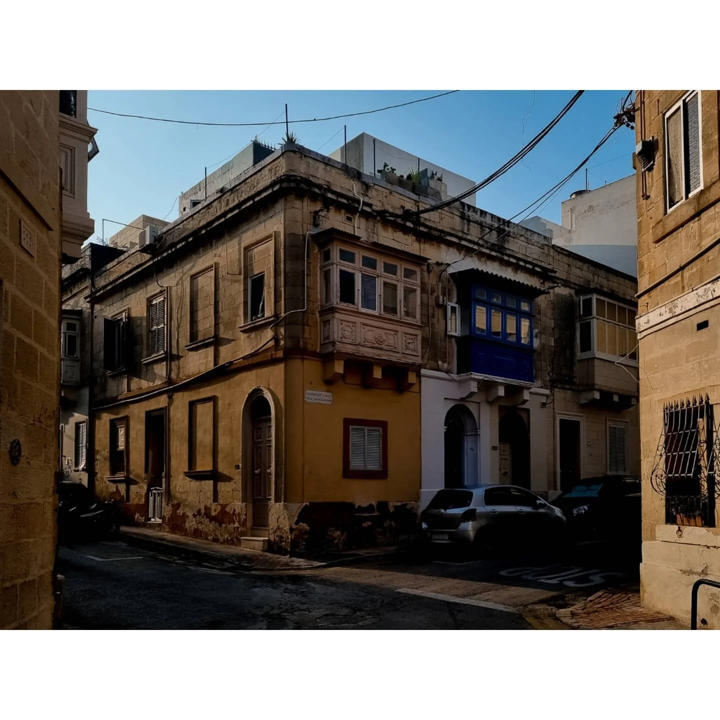 Wandering around Sliema by foot, observing the way the sun filters through and casts shadows on the mish-mash of townhouses, is one of my favourite things in Malta. Lucky, since I don't have a car! 
A local told me that Sliema used to be where the w