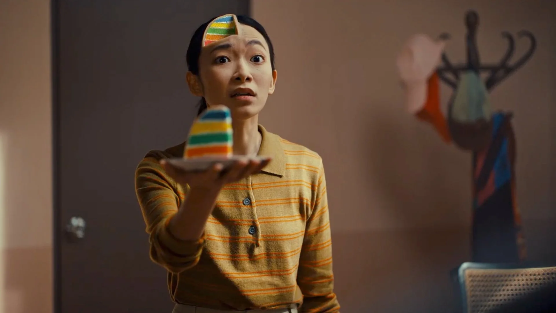 Women holding a piece of cake