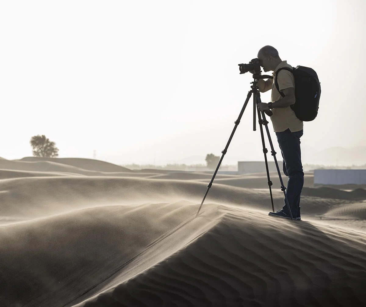 A photographer during a desert storm