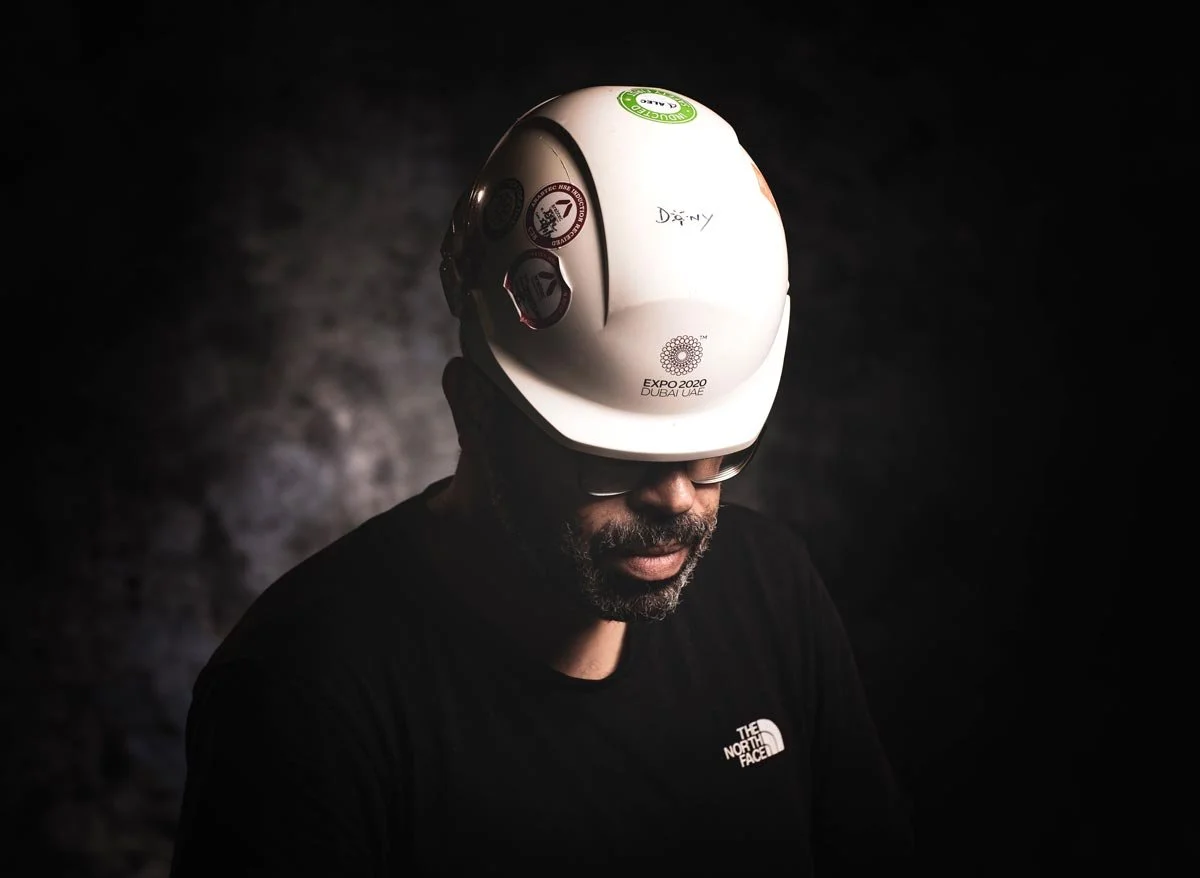 Portrait of photographer Dany Eid wearing an Expo 2020 Dubai hard hat
