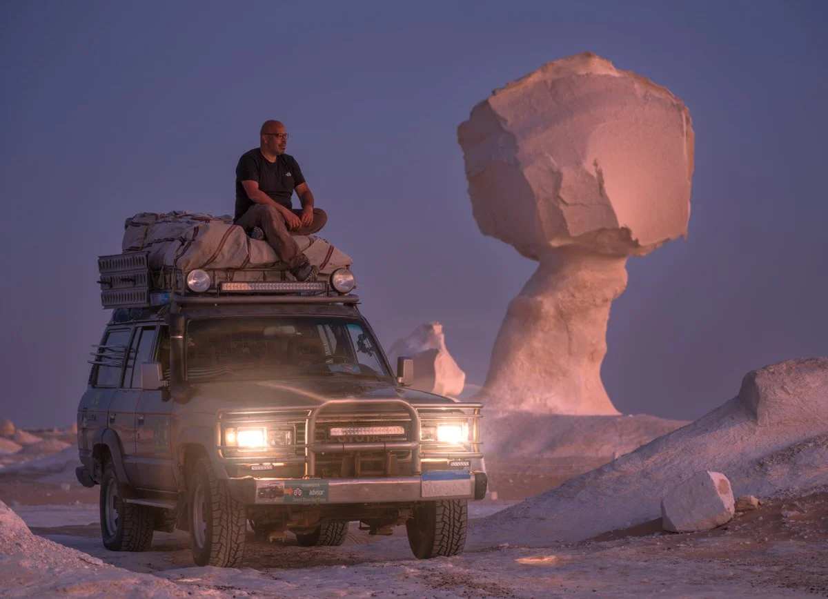 Explore Egypt’s White Desert through Dany Eid’s photography, capturing an overland adventure among sculpted chalk formations in the soft glow of twilight.