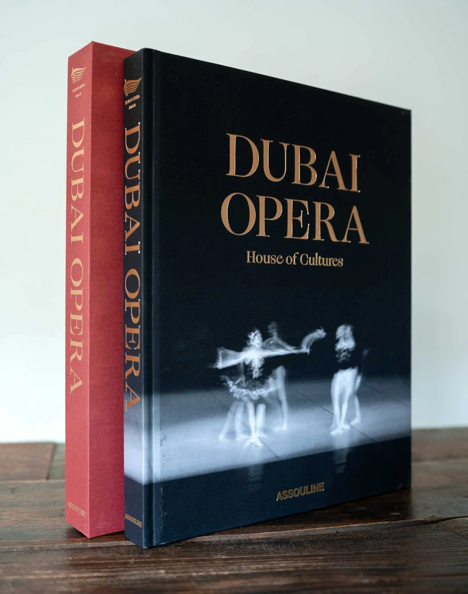 Dubai Opera: House of Cultures, an Assouline coffee table book featuring architectural photography by Dany Eid, displayed with its black hardcover, gold lettering, and red presentation case.