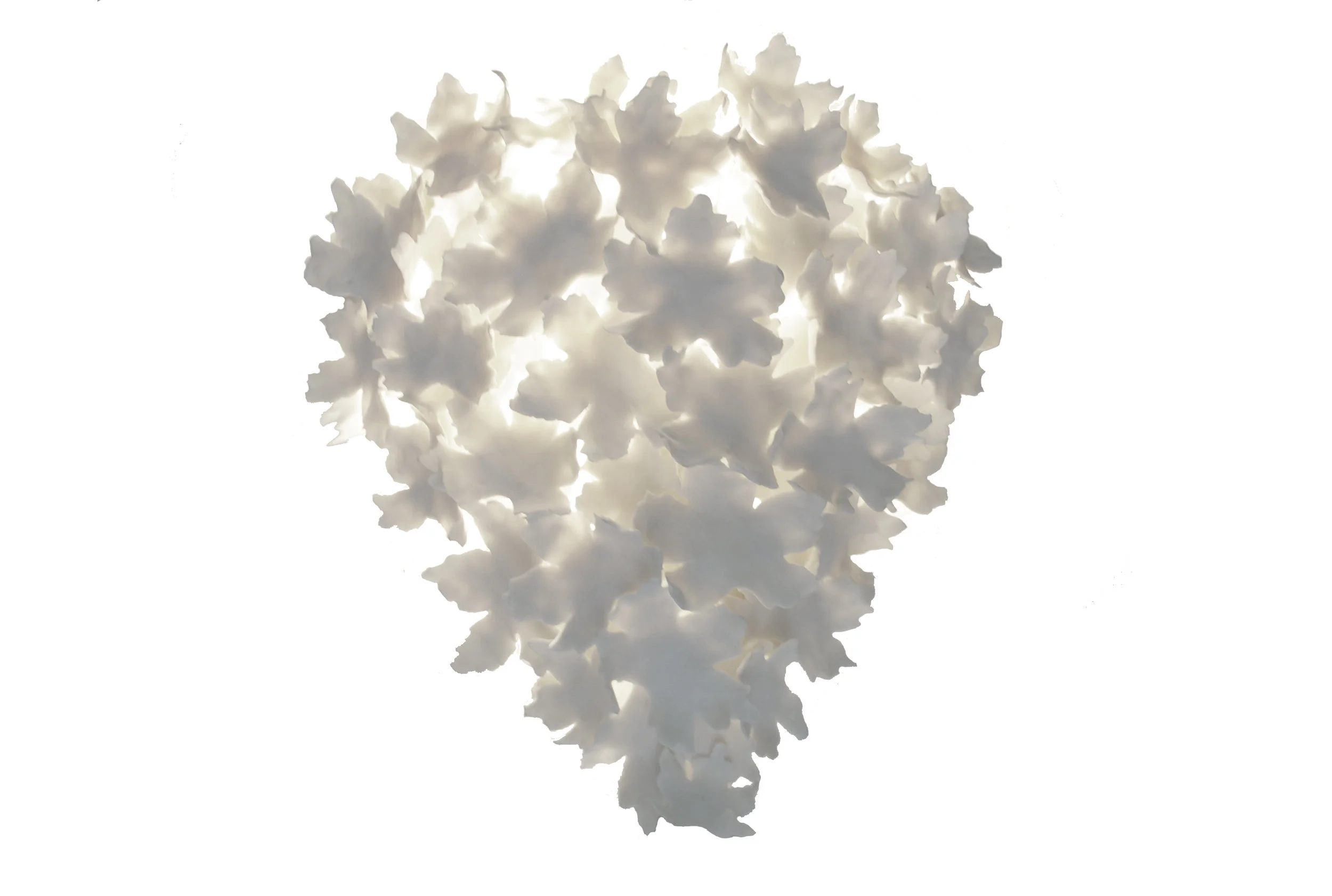 This is a coned version of the leaves that hangs onto a wall. With an open top that allows the light to pour up, and a coned bottom that crafts the shadows.