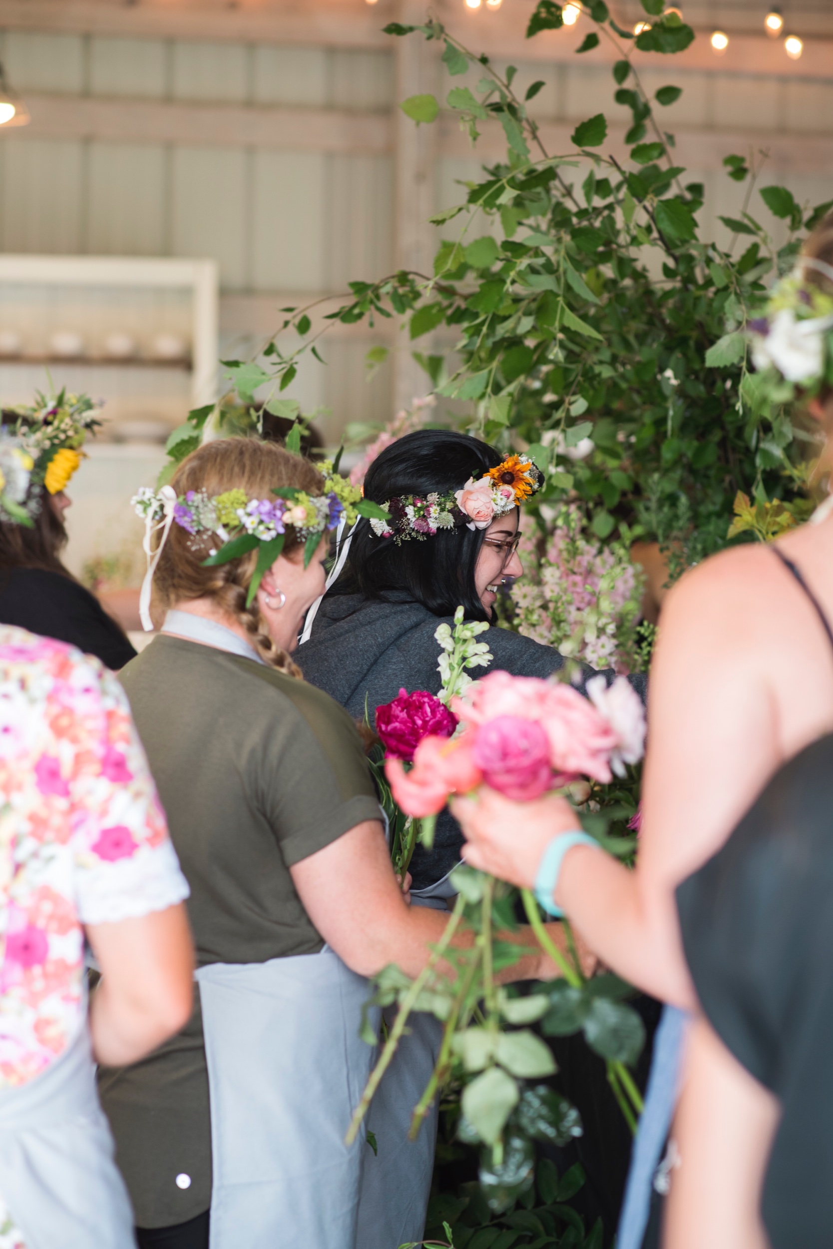 Attendees enjoying the flower bar Photo By: Andraya Stender