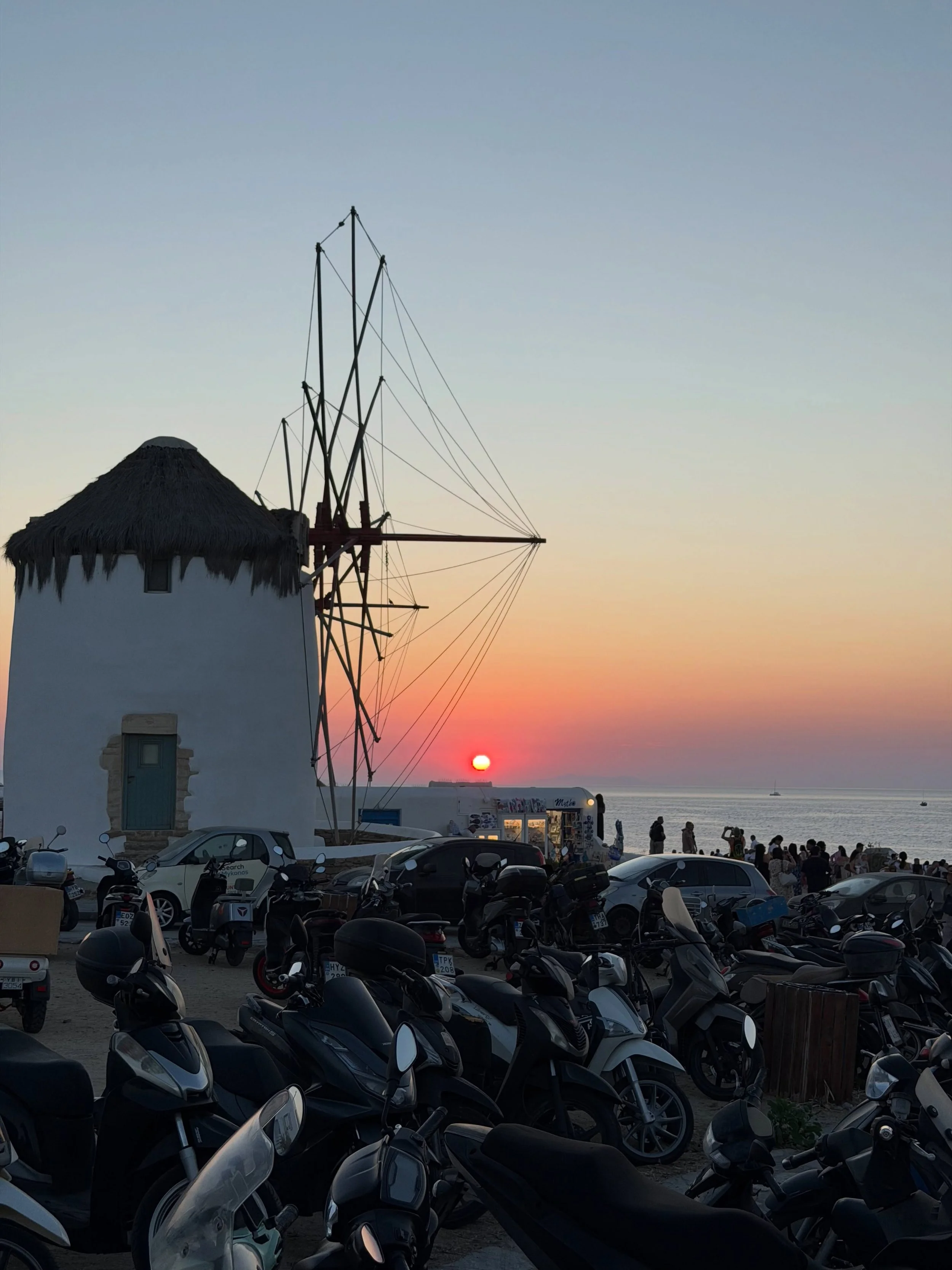Mykonos at golden hour. 🇬🇷✨

As the sun begins to set behind the iconic windmills, Mykonos takes on a completely different kind of magic. The whitewashed buildings glow, the Aegean light softens and the island slows down for a moment.

These are th