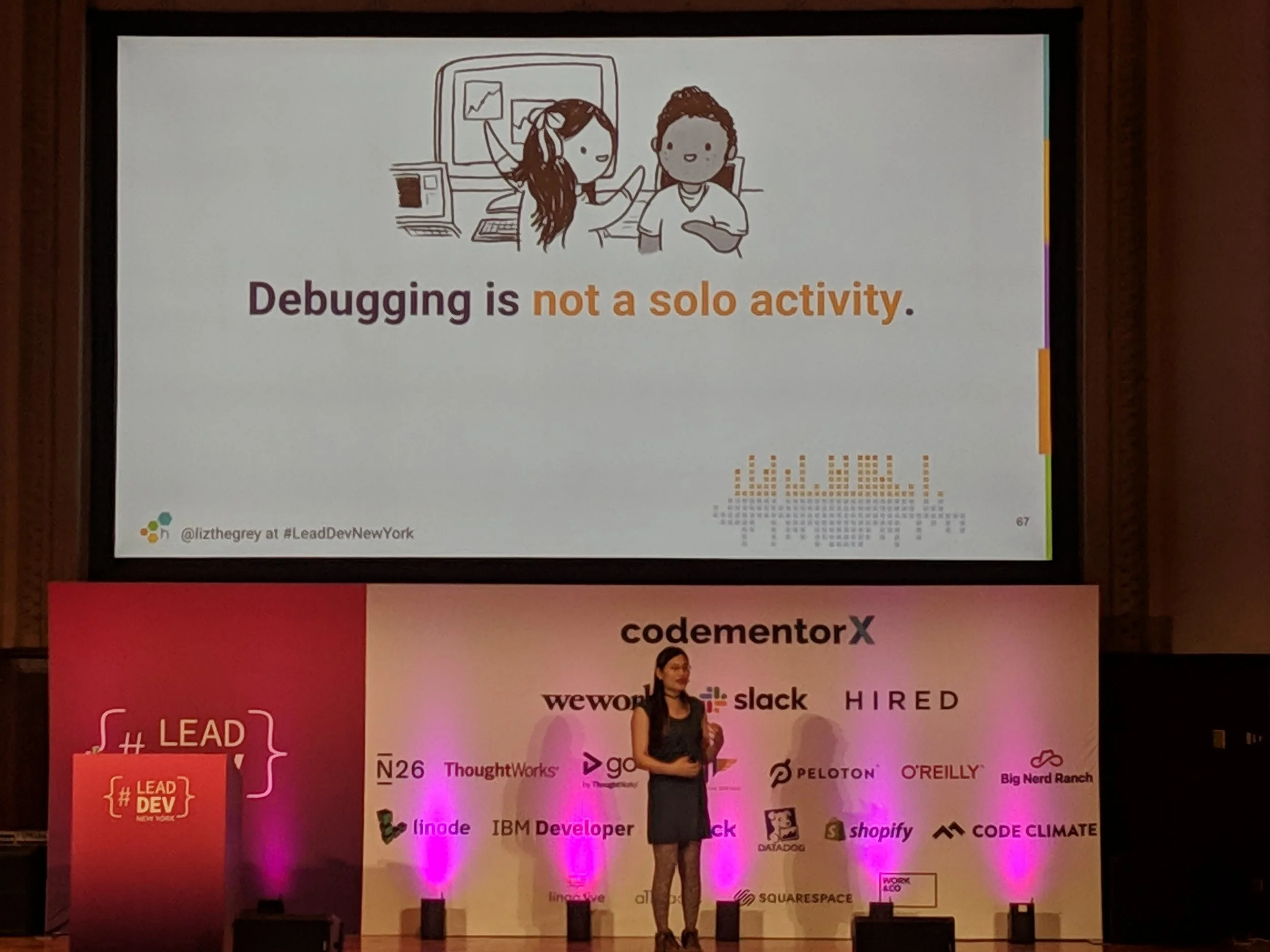 Liz’s slide tells us that “Debugging is not a solo activity.” Cute image of people debugging together by the extraordinarily talented @emilywithcurls.