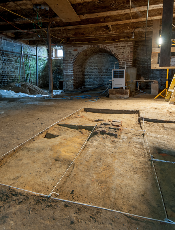 A brick foundation discovered in the cellar of the house. 