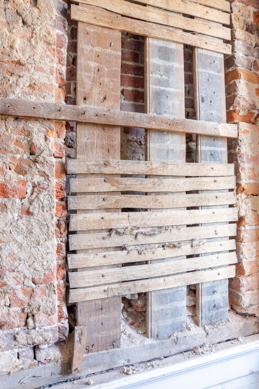 One of the window openings that was enclosed during one of the renovations to the house. These are visible in the brickwork on the front facade of the house.