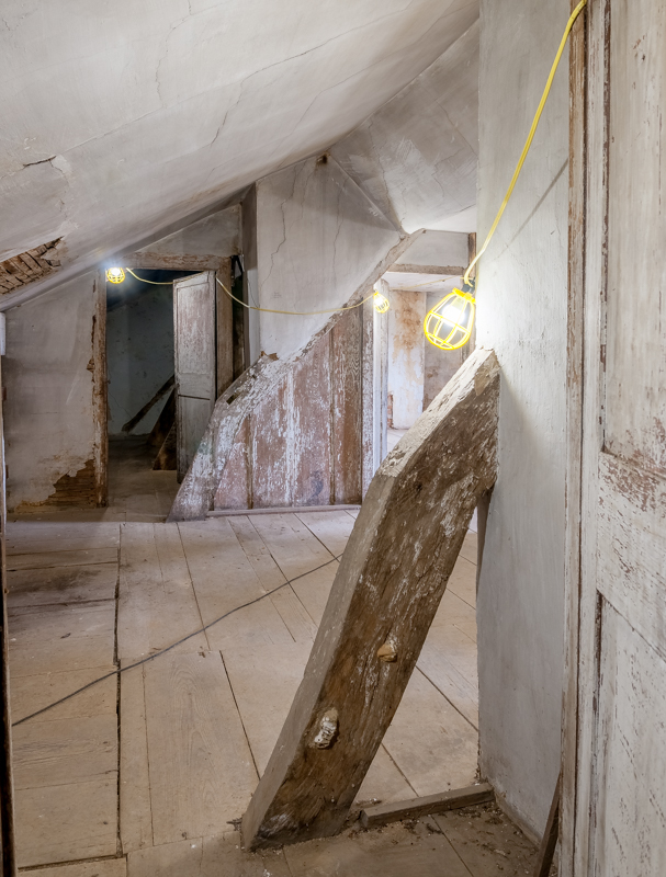 Two bent principal rafters in the third-floor attic of the cloverfields house. / Photographer: Pete Albert, 2018.