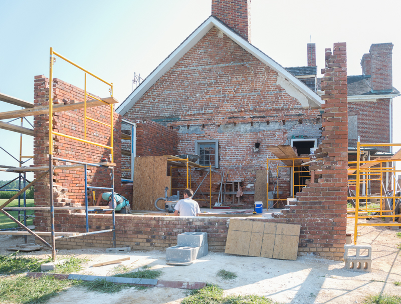 the 1784 kitchens masonry walls going up. the fireplace and beehive oven will be in the wall at the foreground. photo by Pete Albert
