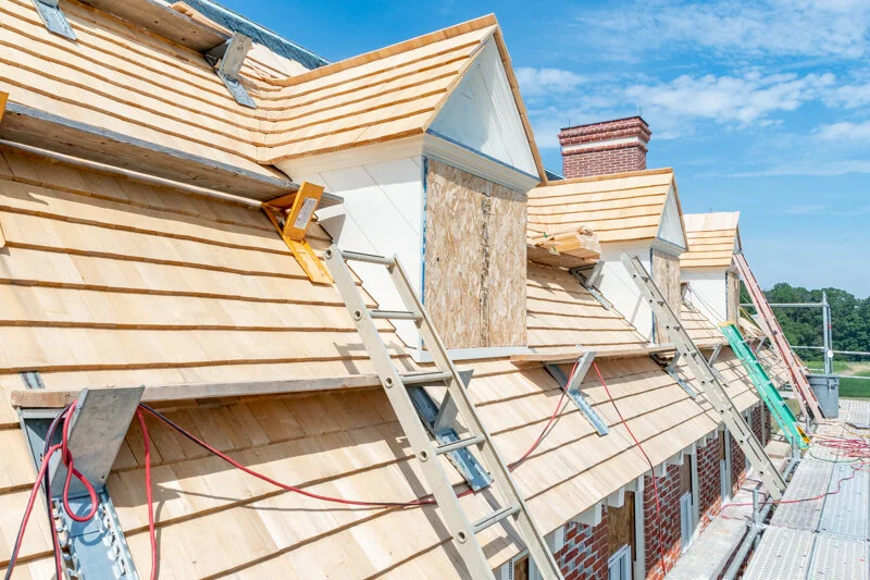 Process photo of the cloverfields main house dormer reconstruction. in this photo the cedar shakes and trim have been completed. Photo by Pete albert, 2020.