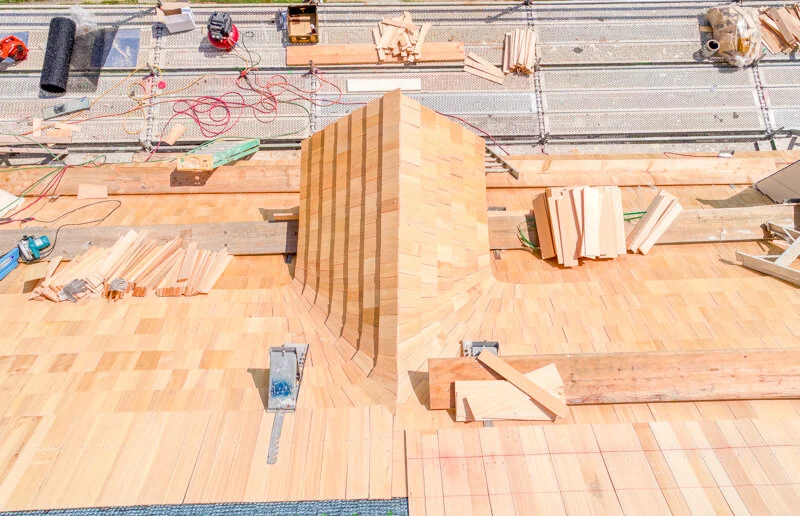 Process photo of the cloverfields main house dormer reconstruction. in this photo the cedar shakes and trim have been completed. Photo by Pete albert, 2020.